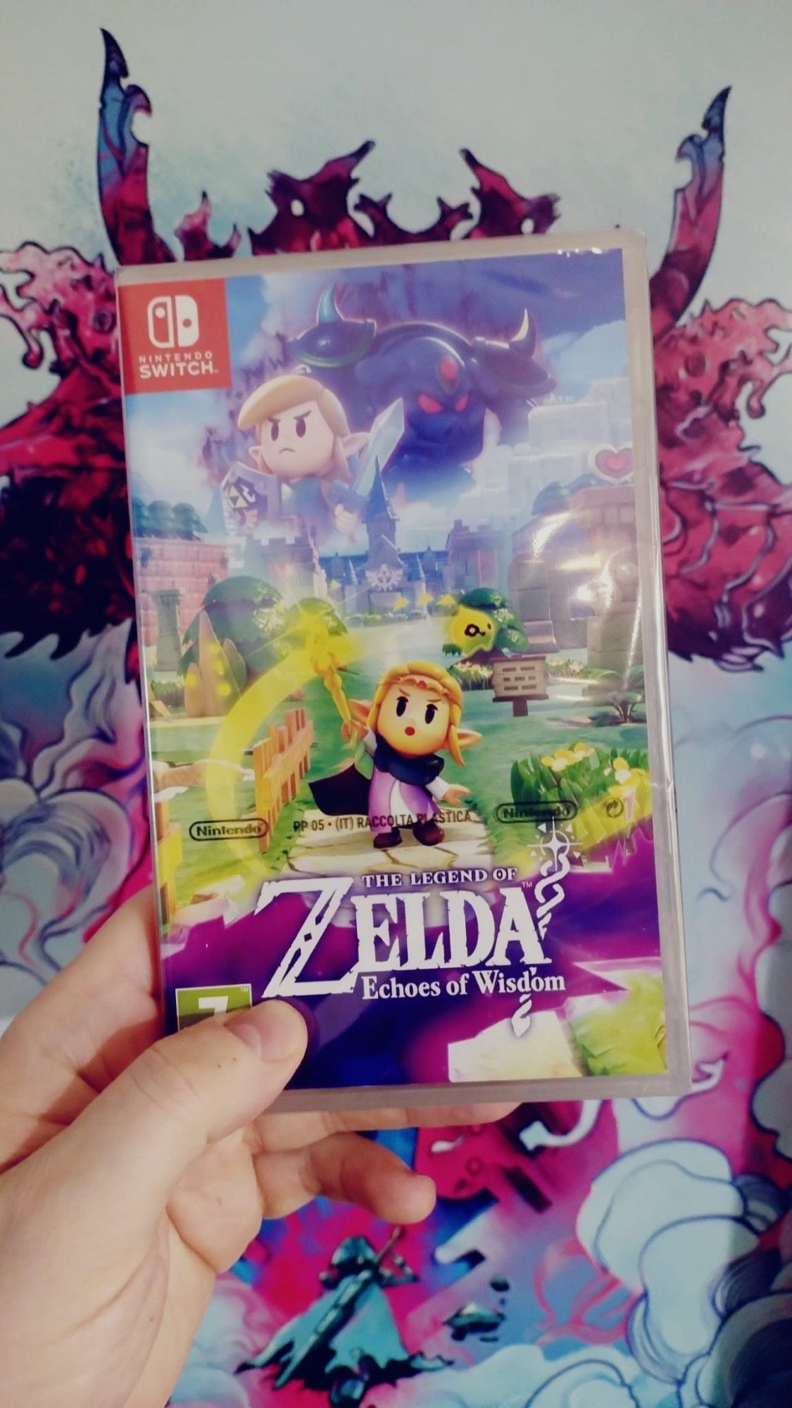 My hand is holding a fresh copy if new Zelda game: Echoes Of Wisdom for Nintendo Switch