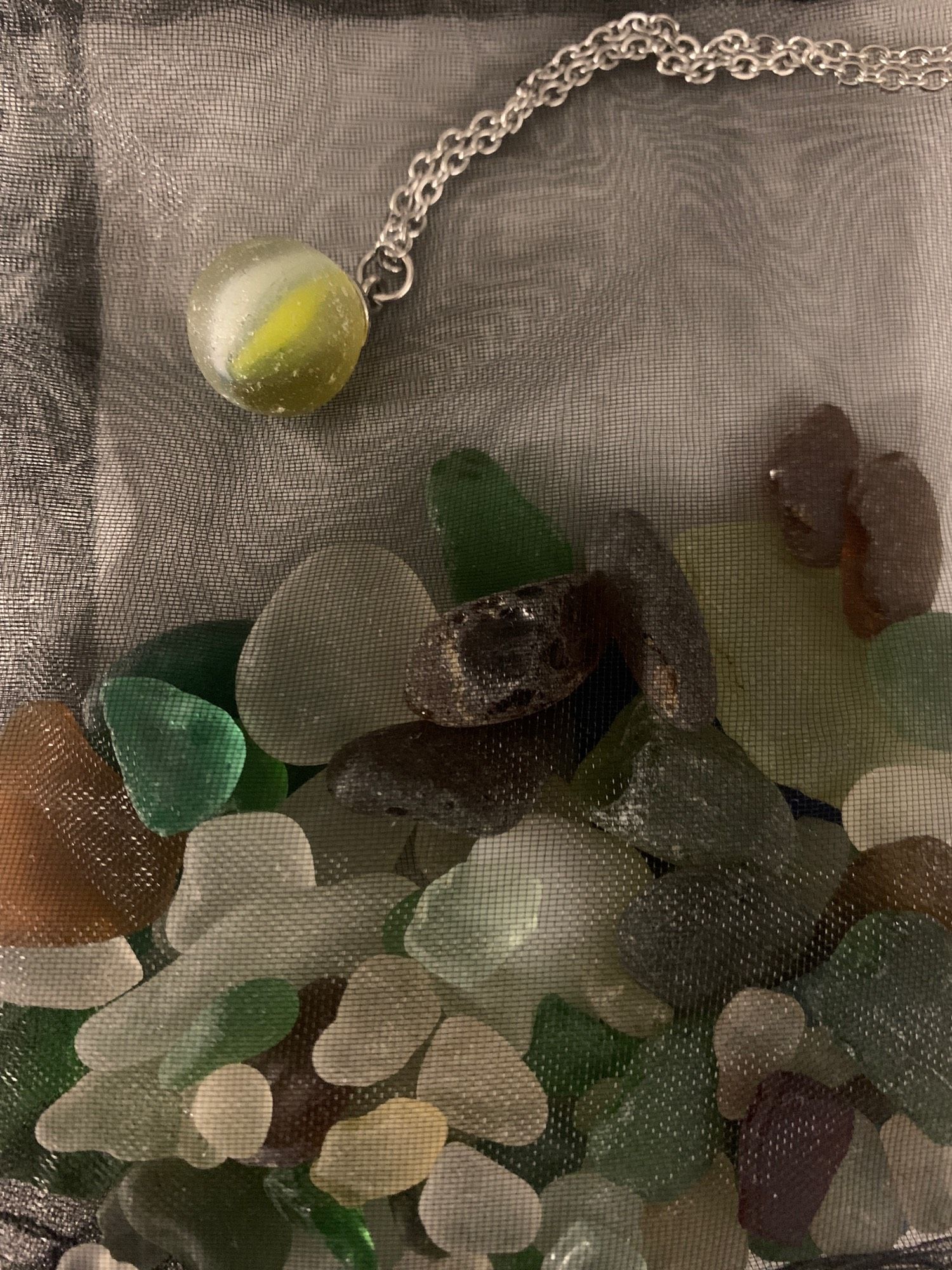 Tri-coloured toothpaste swirl cat’s eye marble circa 1940-1950 necklace and lots of sea glass in a bag gifted to me by Mike at Sea Glass Archaeology.