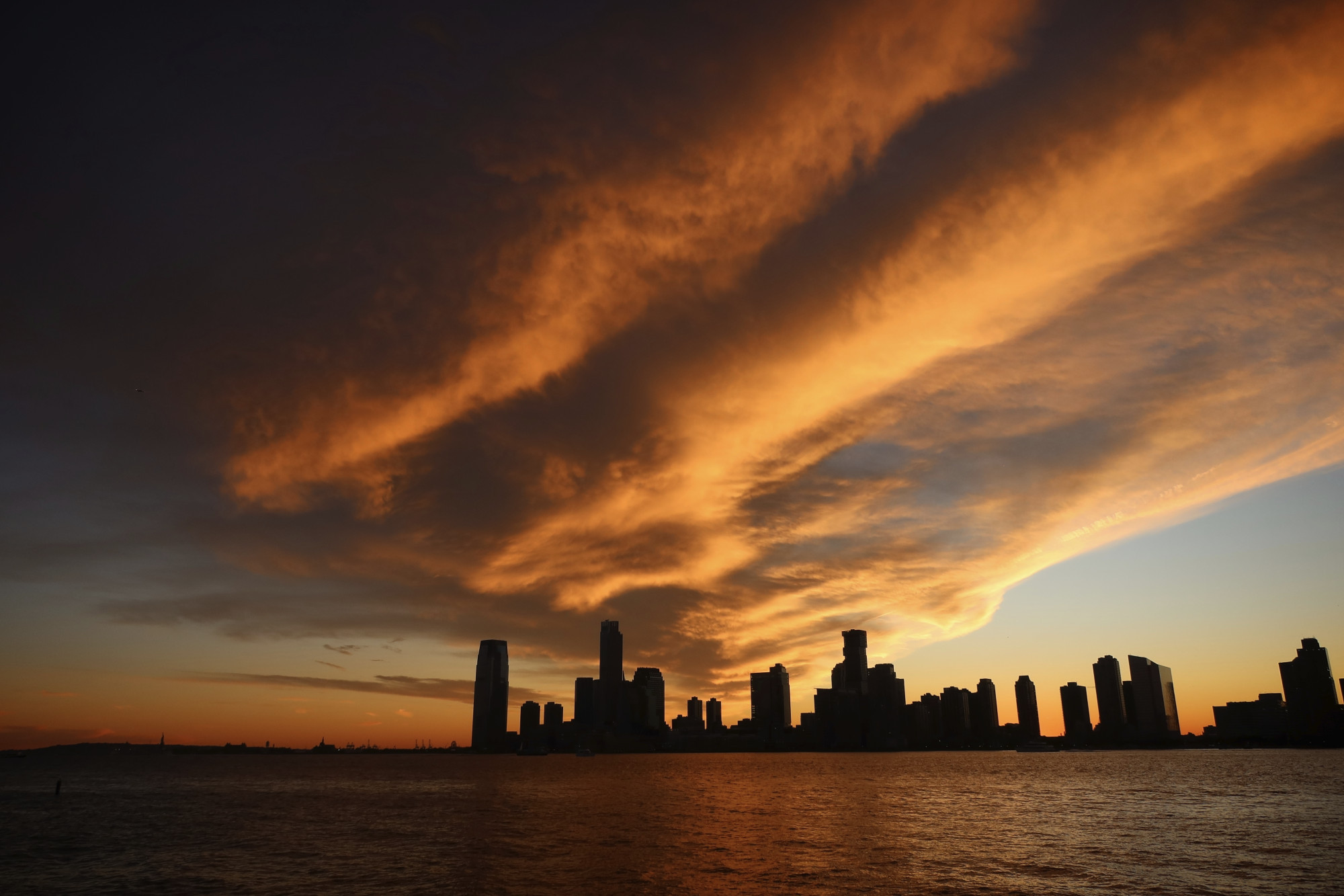 Sunset over Jersey City, as seen from Manhattan looking across the Hudson River.