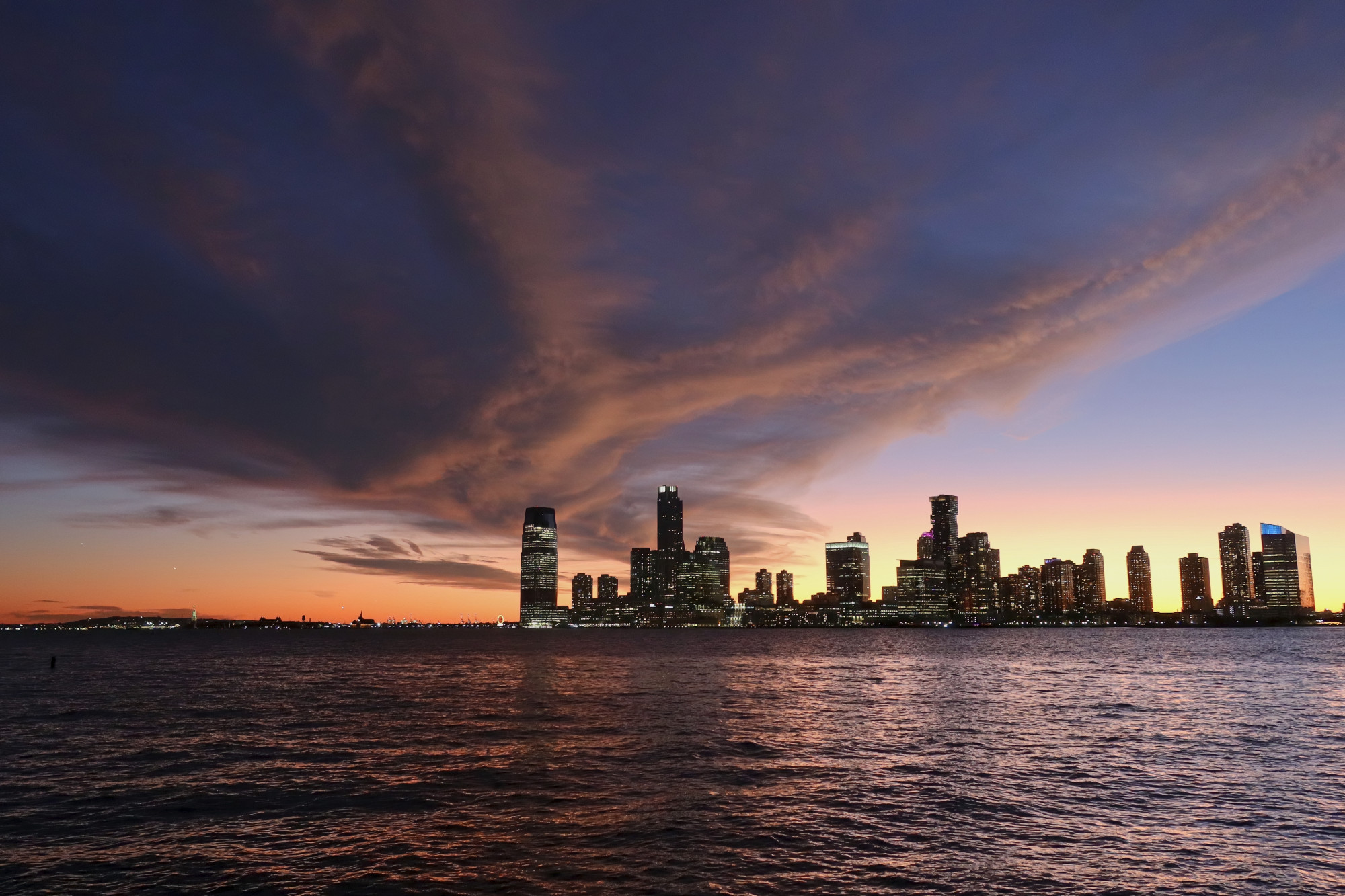 Sunset over Jersey City, as seen from Manhattan looking across the Hudson River.