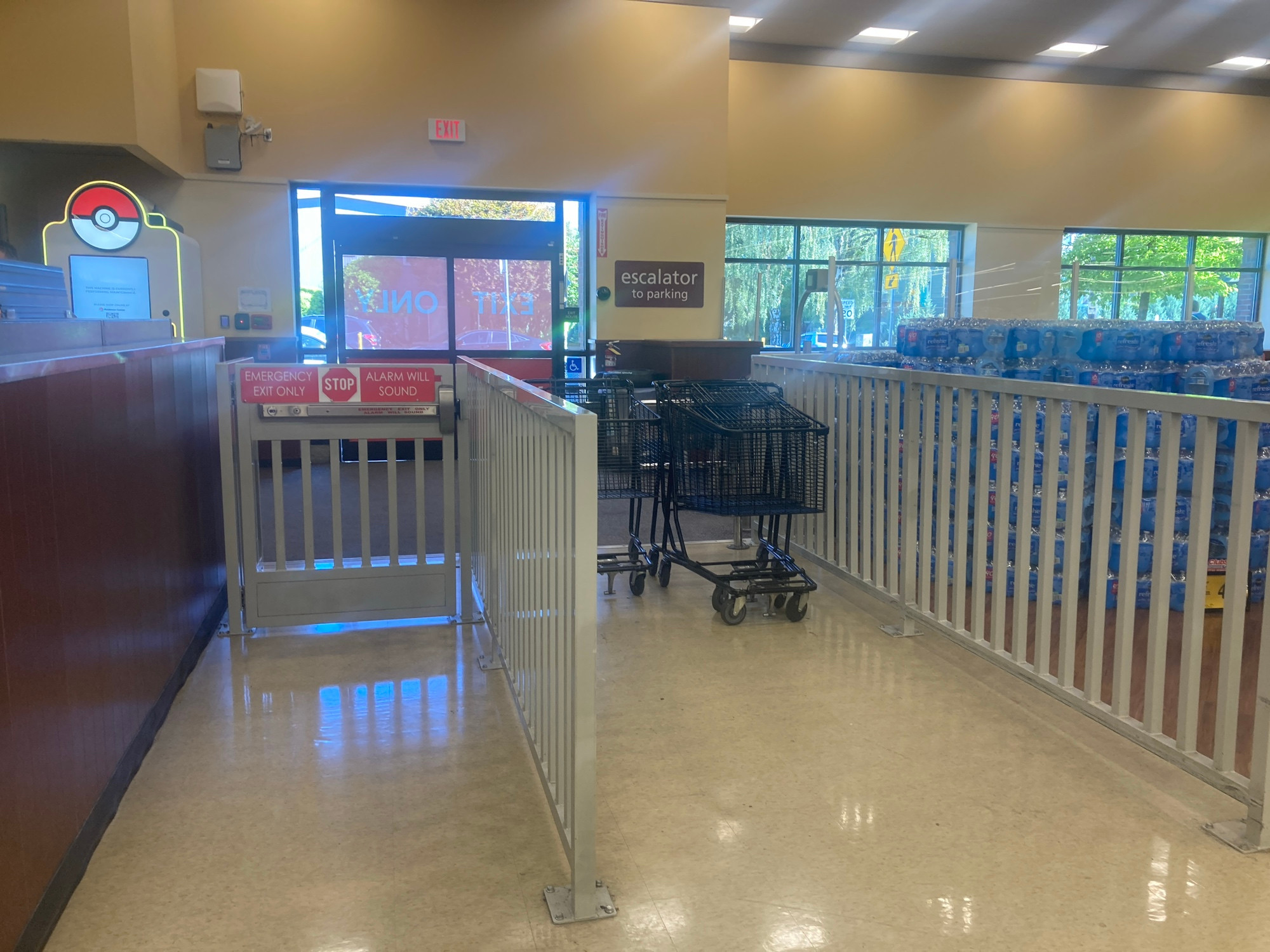 A fence inside a grocery store. 