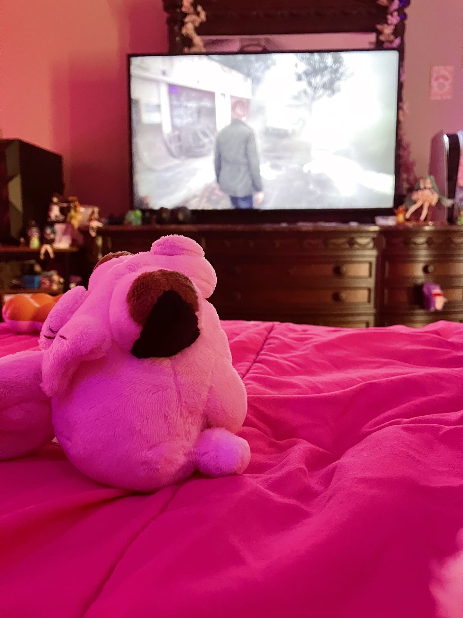 tiny sitting clefairy sitting on the bed with silent hill 2 remake on the tv 