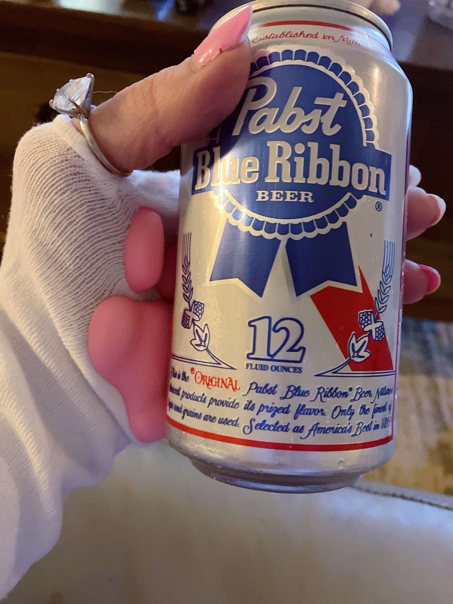 me with a paw arm warmer holding a pabst beer