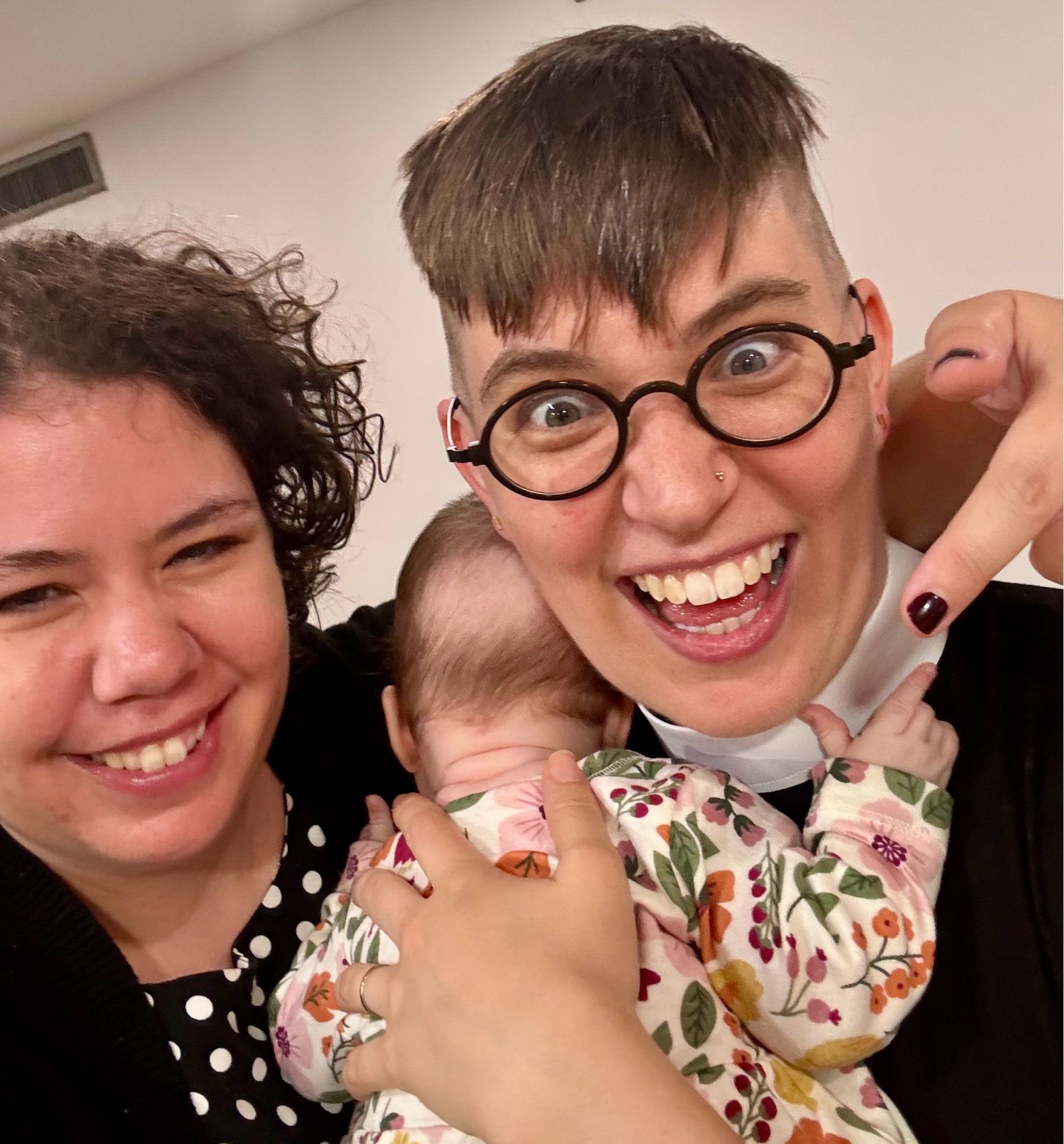 Photograph of Elizabeth and Flourish, who is holding Trinity the baby.