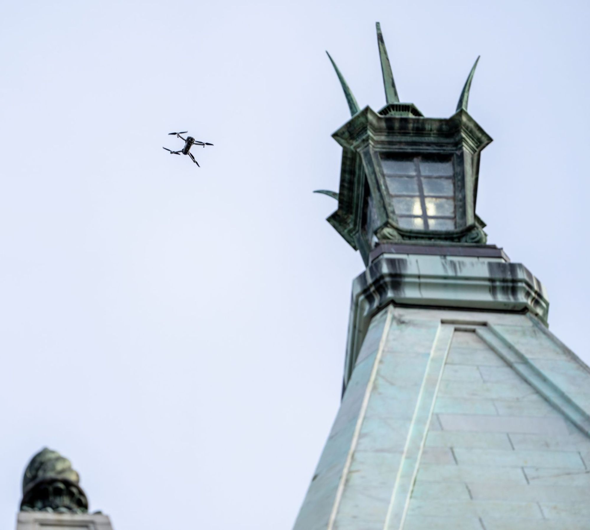 A drone flying above the lantern of the Campanile.