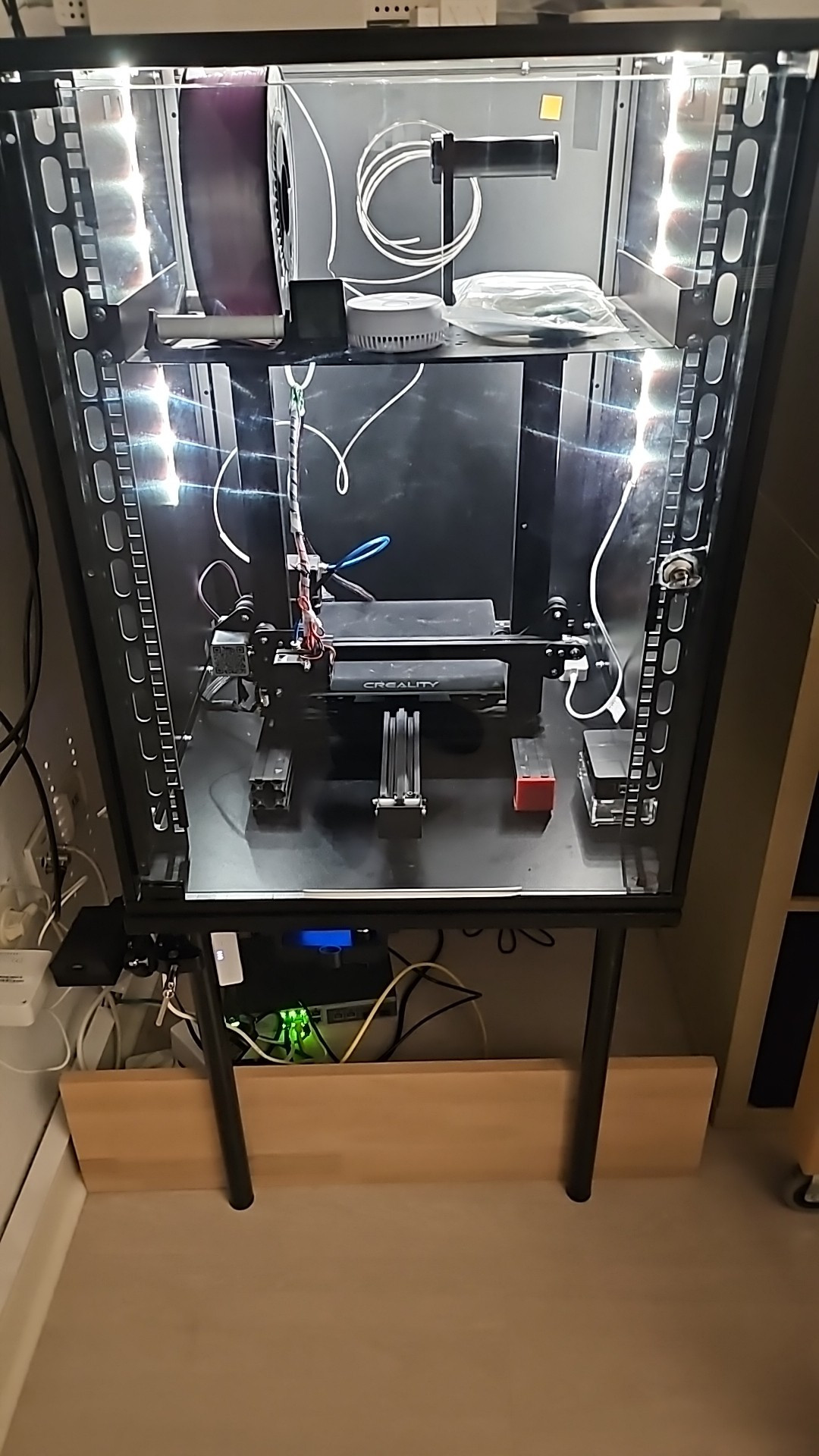 3D printer in a 19" Network Rack with some smart lighting to better see the prints