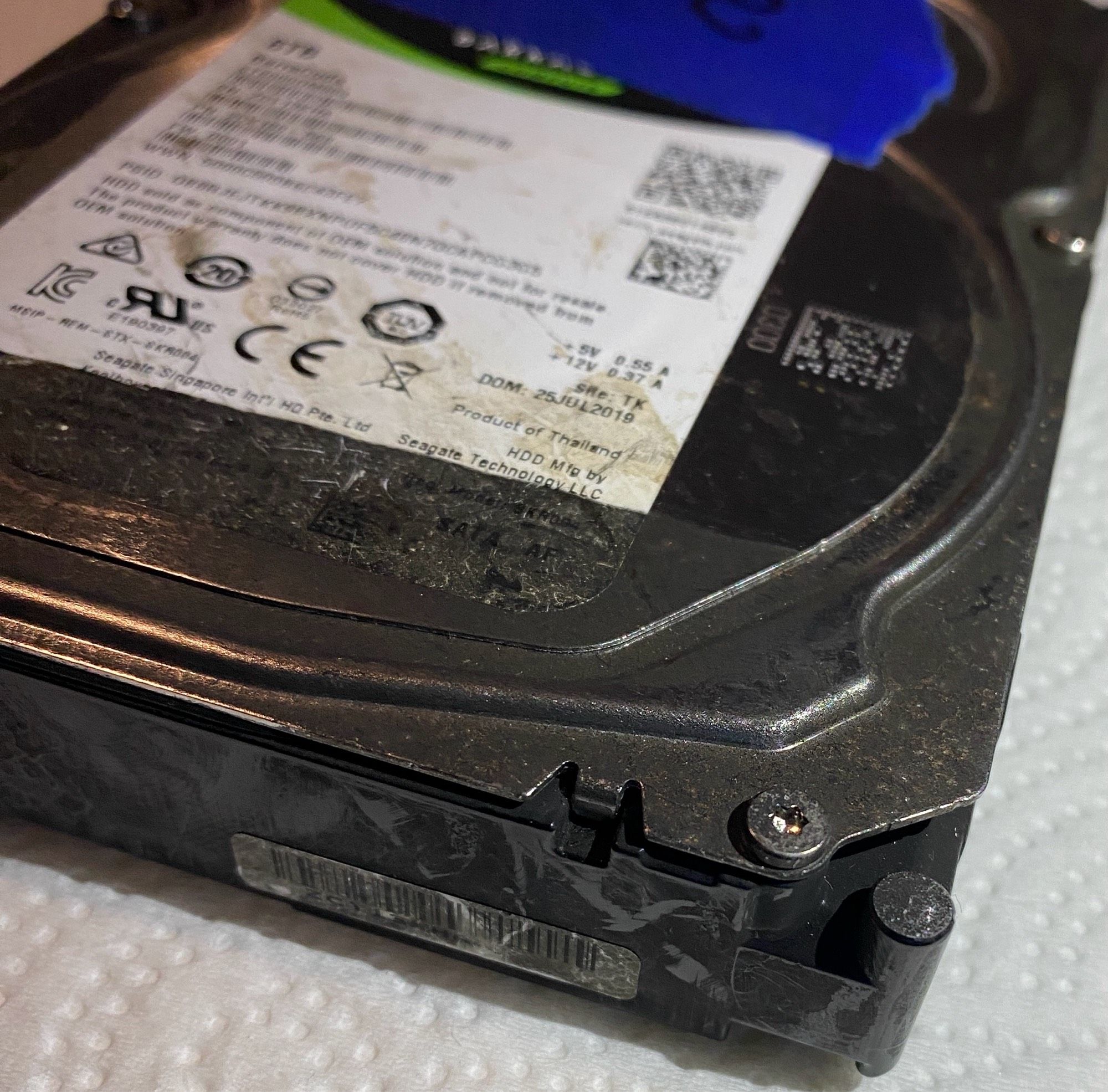 Internal HDD. Covered in ash, except for a spot where some tape was removed.