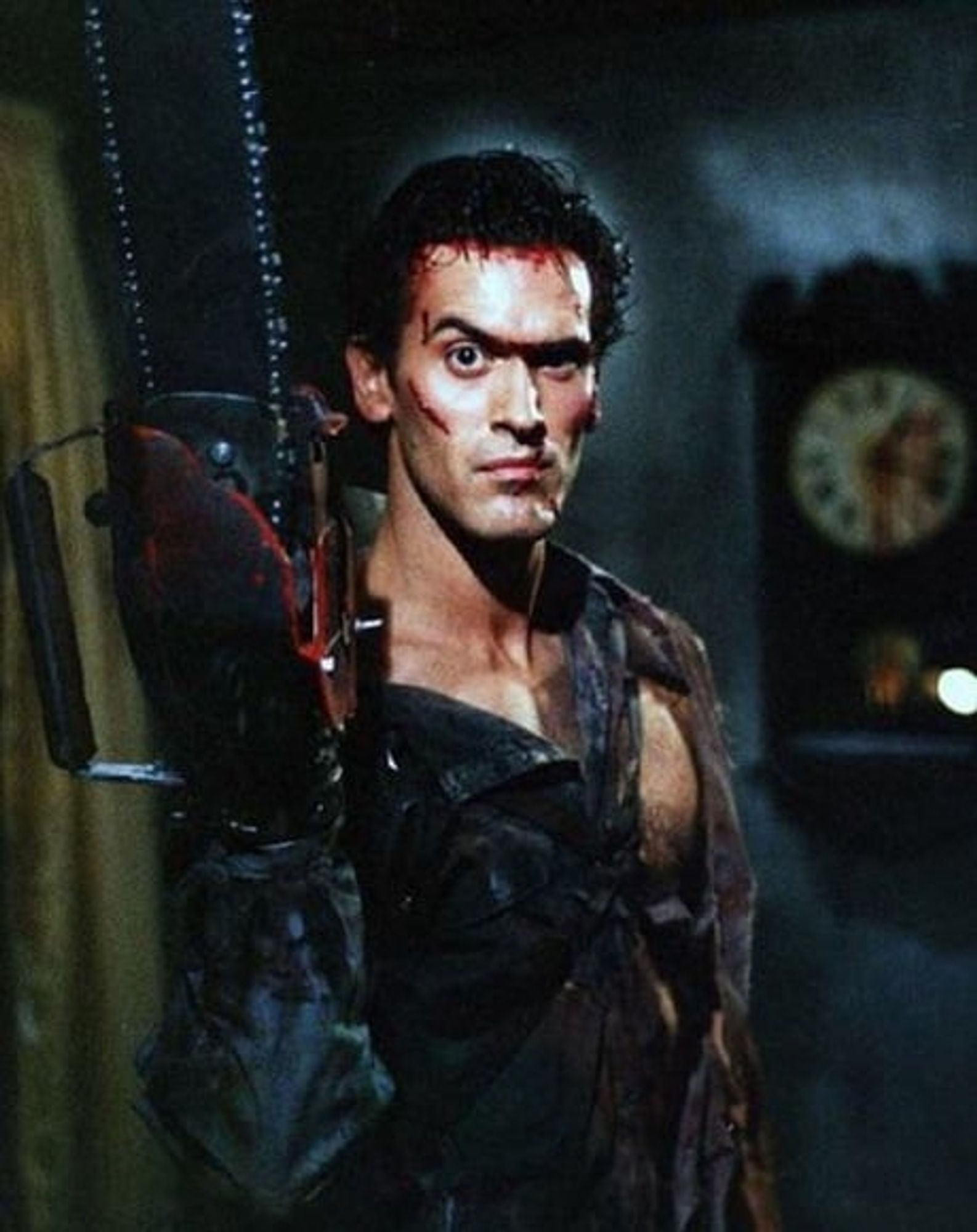 Ash from Ash versuses the Evil Dead with his ripped shirt and chainsaw arm clearly visible