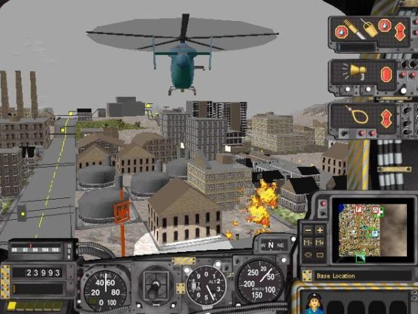 A screenshot from the game, SimCopter. A helicopter is flying above industrial buildings. One of the buildings is on fire.