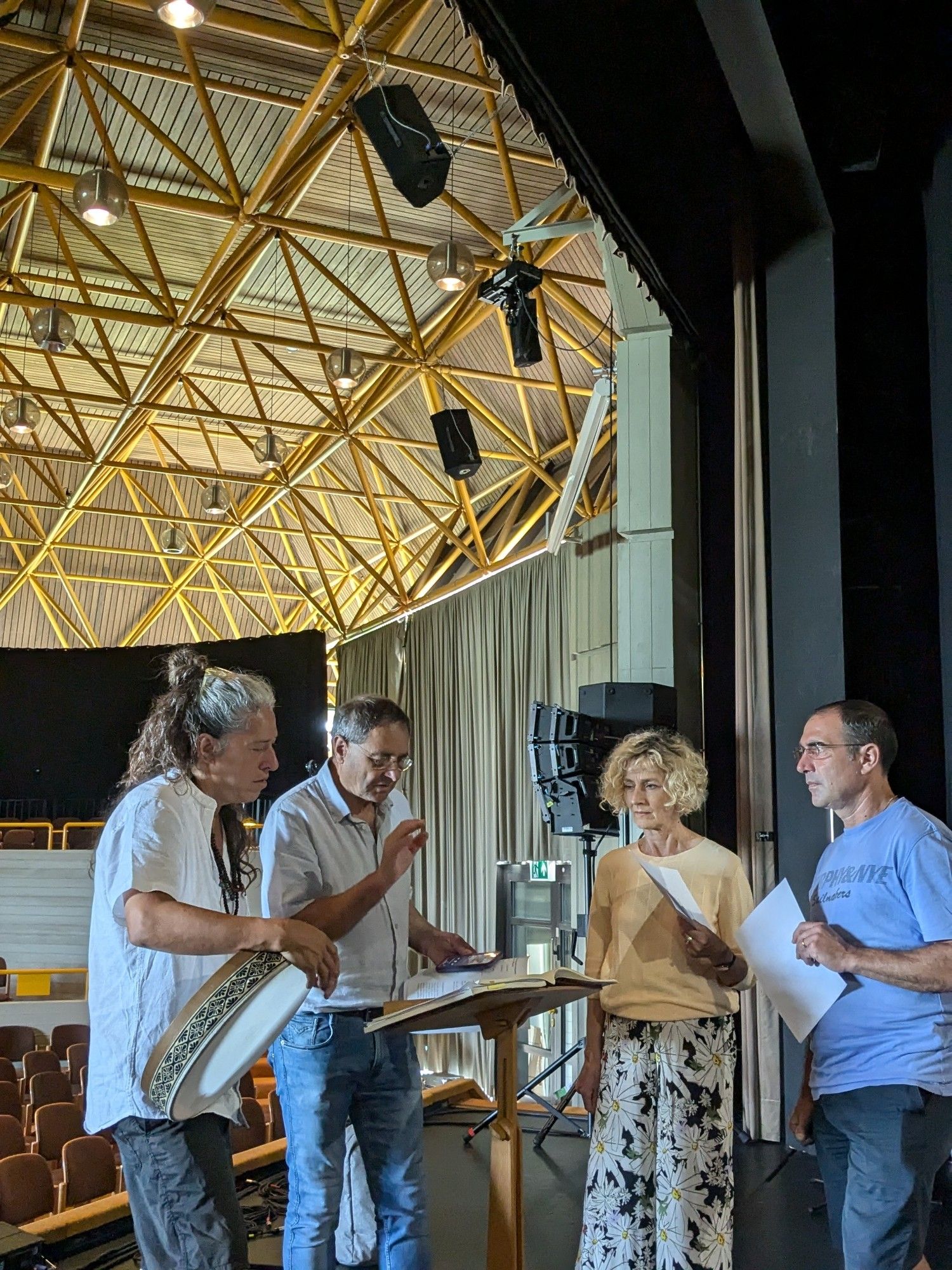 Musicians learning the score with the director