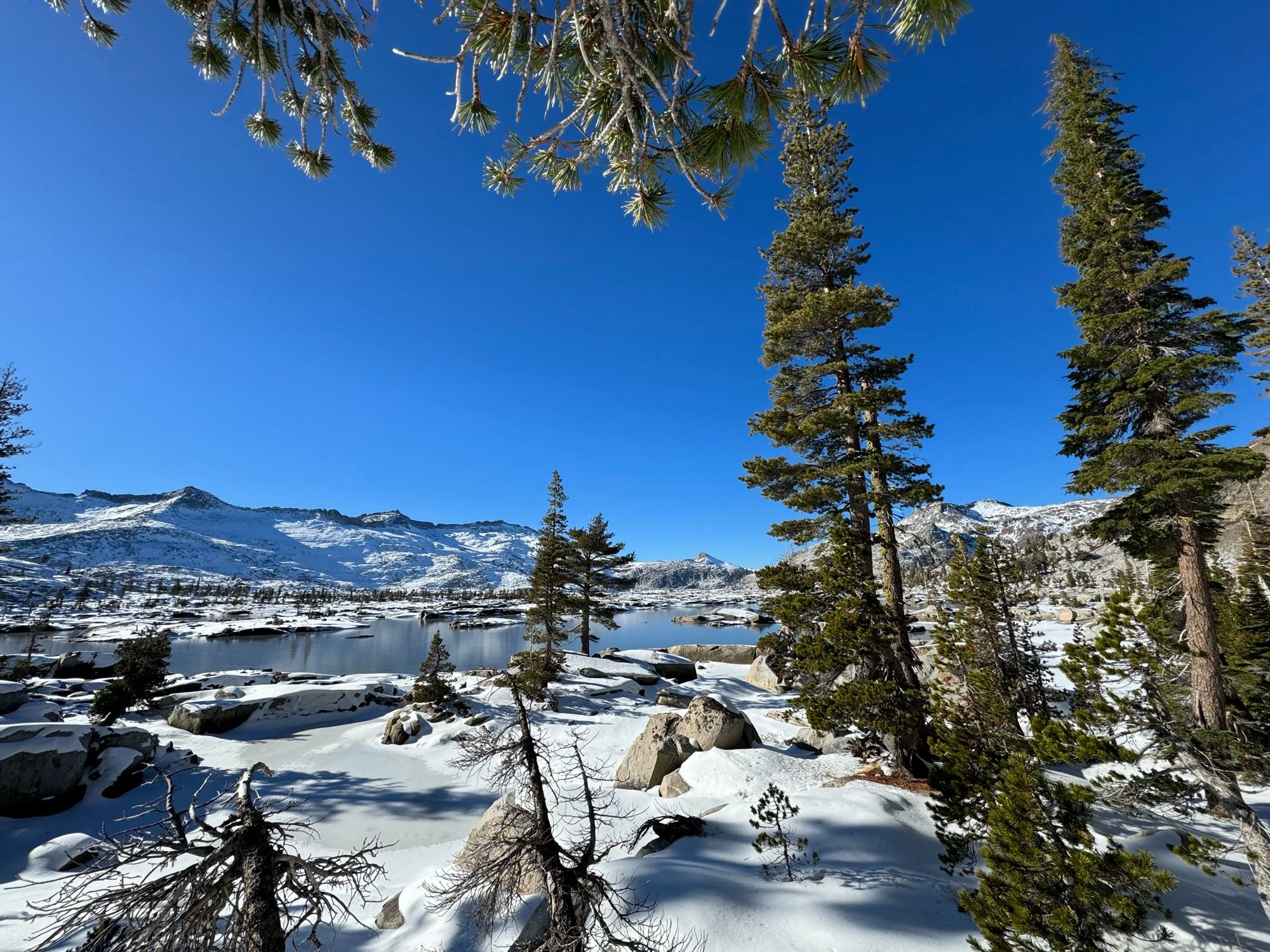 Snow covered alpine Lake Aloha