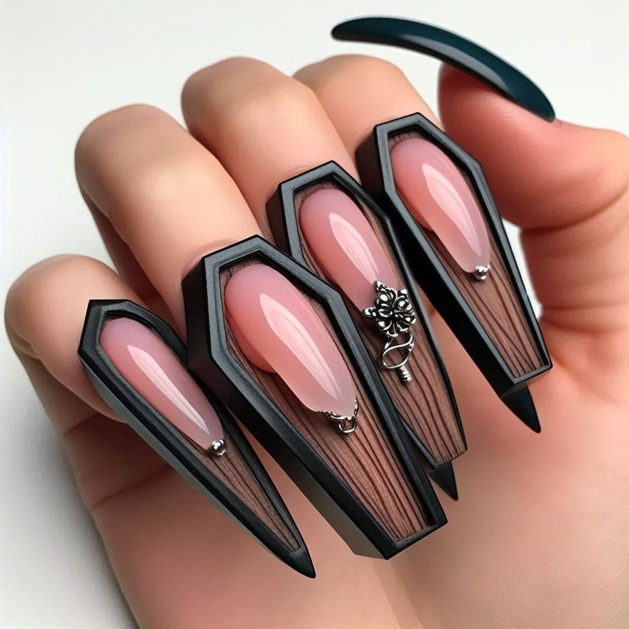 Digitally created image of a hand with coffin-shaped nails. The nails have a glossy finish with a pinkish nude center and black borders, mimicking the appearance of coffins. One nail is adorned with small silver embellishments and a tiny silver skull charm.#Fashion #Style #Nails #Manicure #NailArt #Trends #CoffinNails #DigitalArt #UniqueDesign #FashionStatement #Goth #Dark #Satanic #Underground #GothicFashion #DarkArt #Occult #AlternativeFashion #DarkAesthetic #GothStyle #DarkCulture #Macabre #DarkBeauty #GothicArt #DarkFashion #DarkMusic #GothicLifestyle #DarkWave #BlackMetal #DarkGlamour #GothicSubculture#Gótico #Oscuro #Satánico #Underground #ModaGótica #ArteOscuro #Oculto #ModaAlternativa #EstéticaOscura #EstiloGótico #CulturaOscura #Macabro #BellezaOscura #ArteGótico #ModaOscura #MúsicaOscura #EstiloDeVidaGótico #OndaOscura #Metal #GlamourOscuro #SubculturaGótica