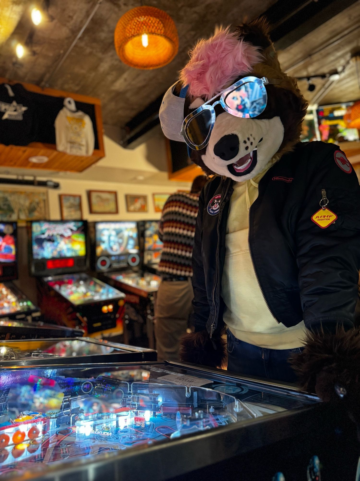 Ponkers playing the Terminator 2 pinball game, wearing aviators and a bomber jacket, moments away from losing the ball