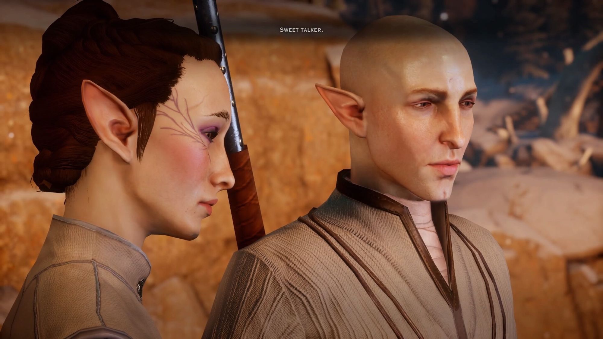 Valylle and Solas in the fade at Haven. Valylle is in profile, Solas in a 3/4 angle, both looking down pensively, the subtitle says “sweet talker.” And those who’ve done the romance know what happens next!