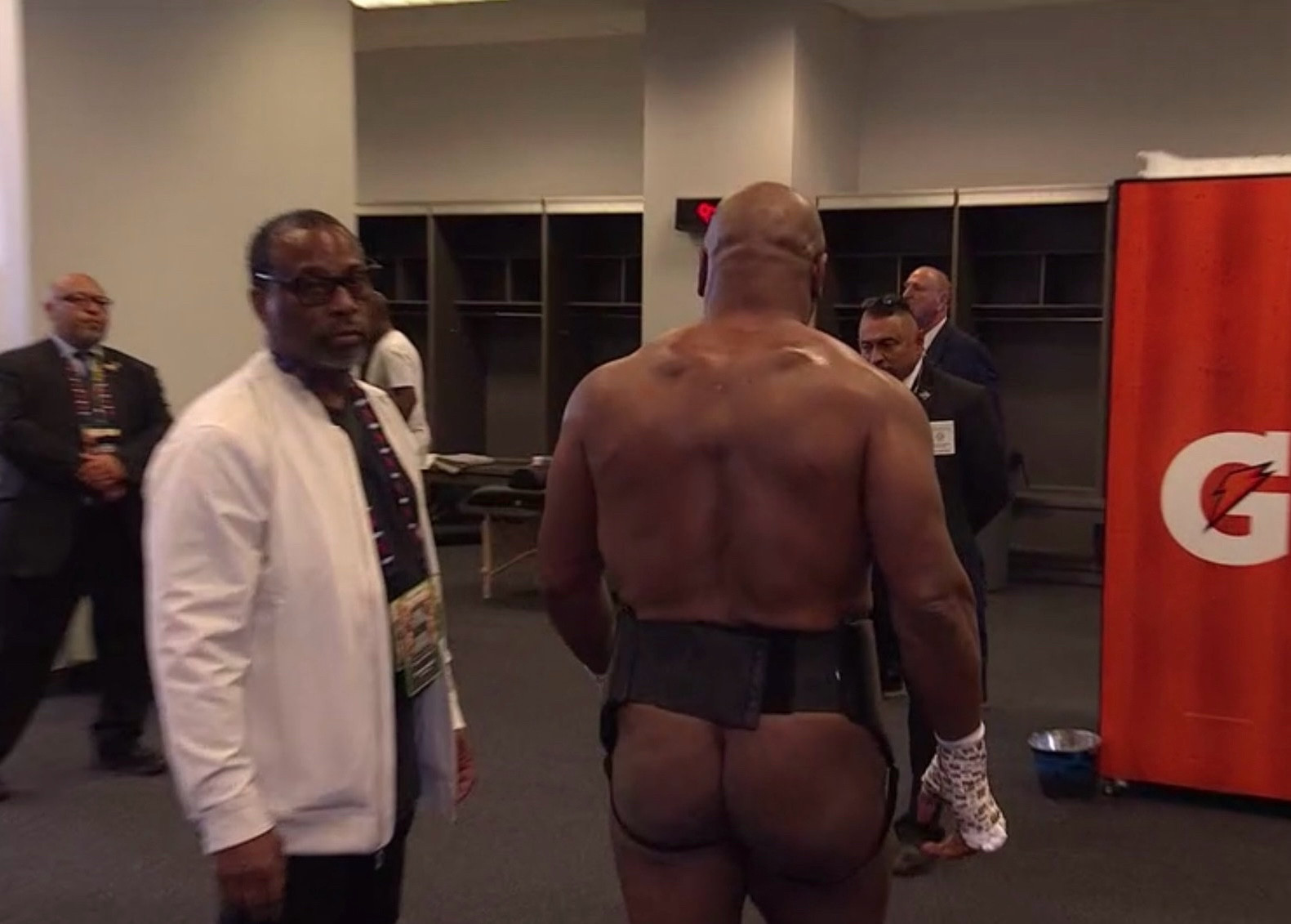 Mike Tyson walking around the locker room with his butt out 