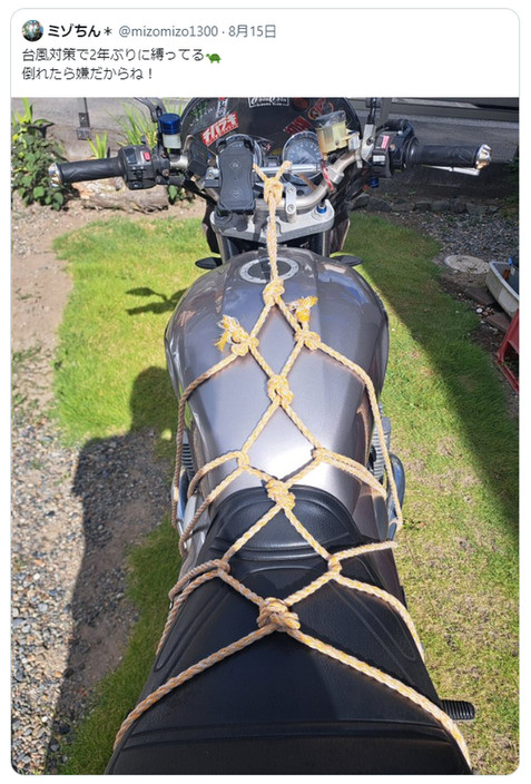 X post showing a motorcyle tied up using bondage knot work