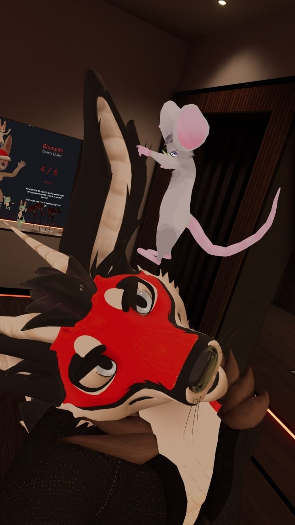 A vr chat photo of a mouse (me) standing on keliff's tilted head comparing my size to his ears