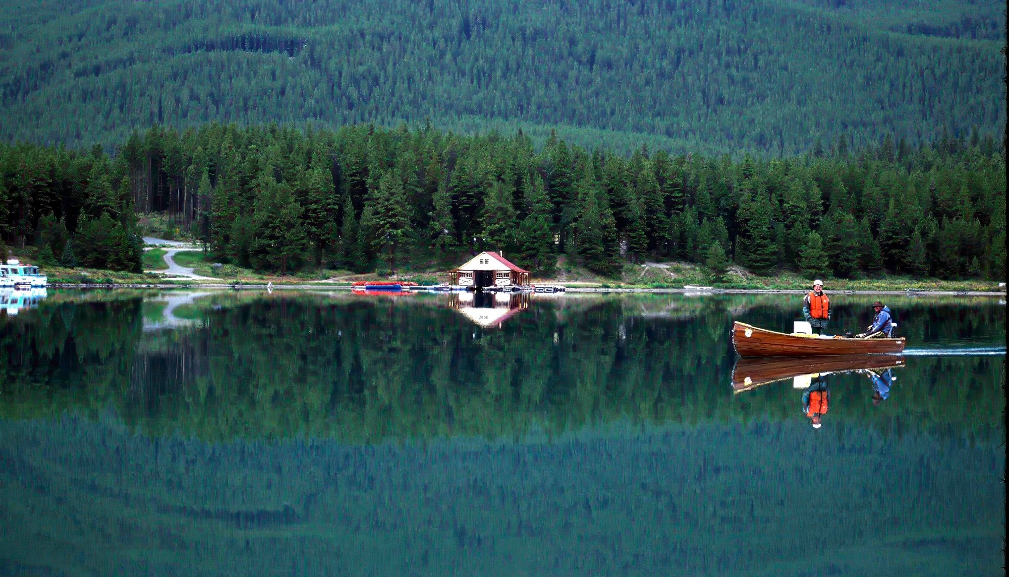 Maligne Lake Boathouse and a couple of anglers who kindly cut their engine for me so the water stayed calm (until wind whipped up shortly thereafter). Oh Canada, eh?!