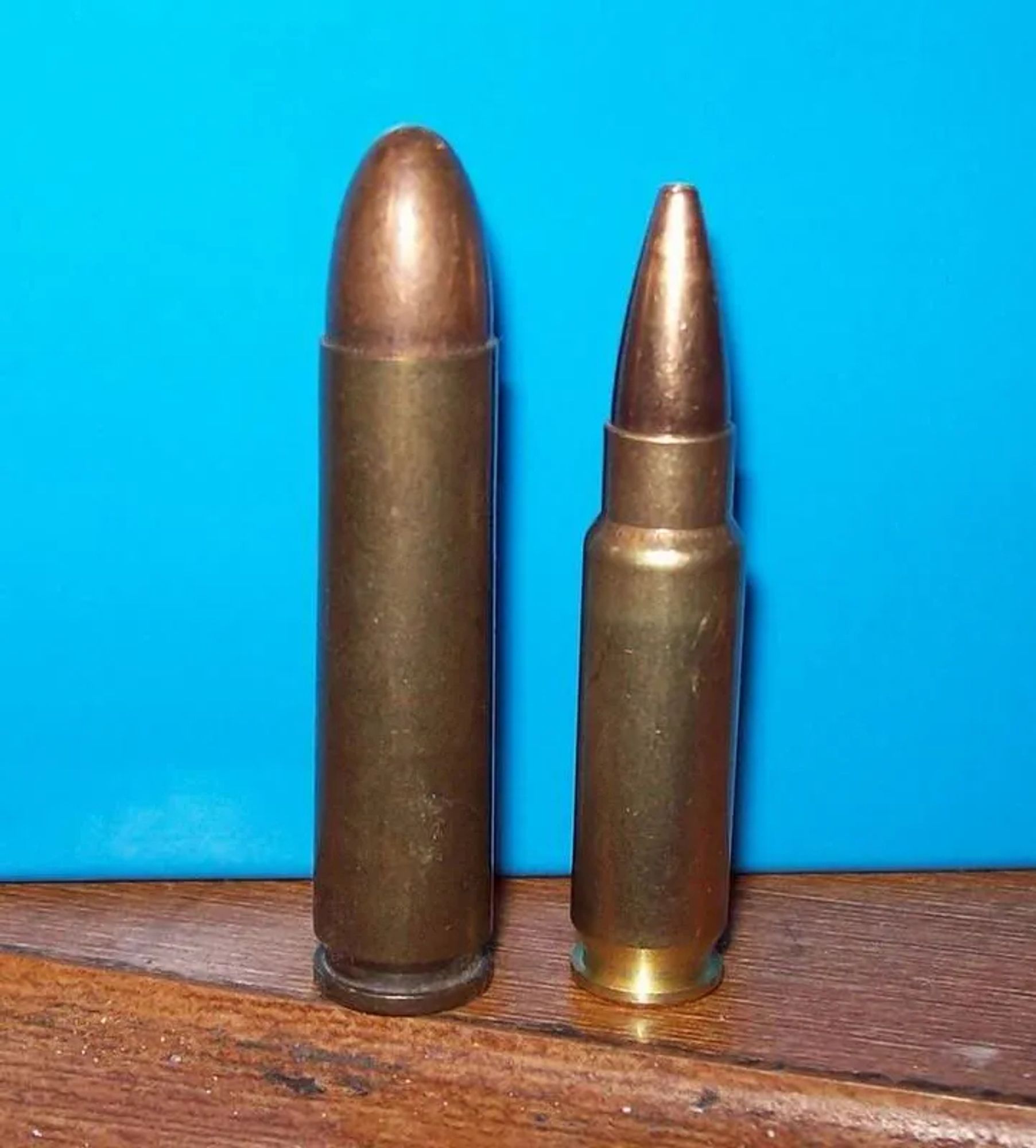 A round of .30 Carbine next to a round of 5.7 to illustrate the size differential. They're about the same size but the case is straightwalled and a little taller on the .30 Carbine.