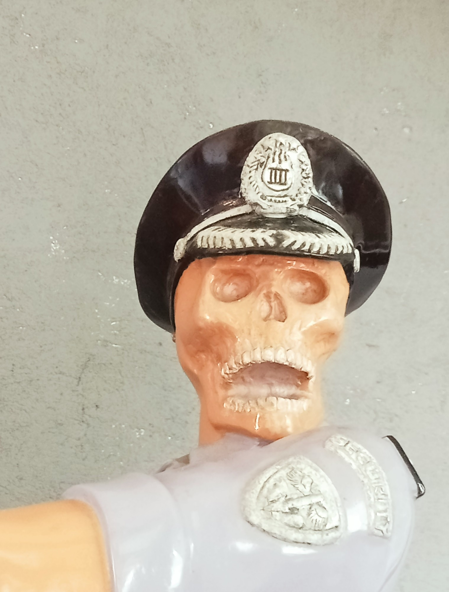 image ID: [a photo of a skeleton statue wearing an officer hat with its jaw hanging open, used as a reaction image of bewilderment. end ID]