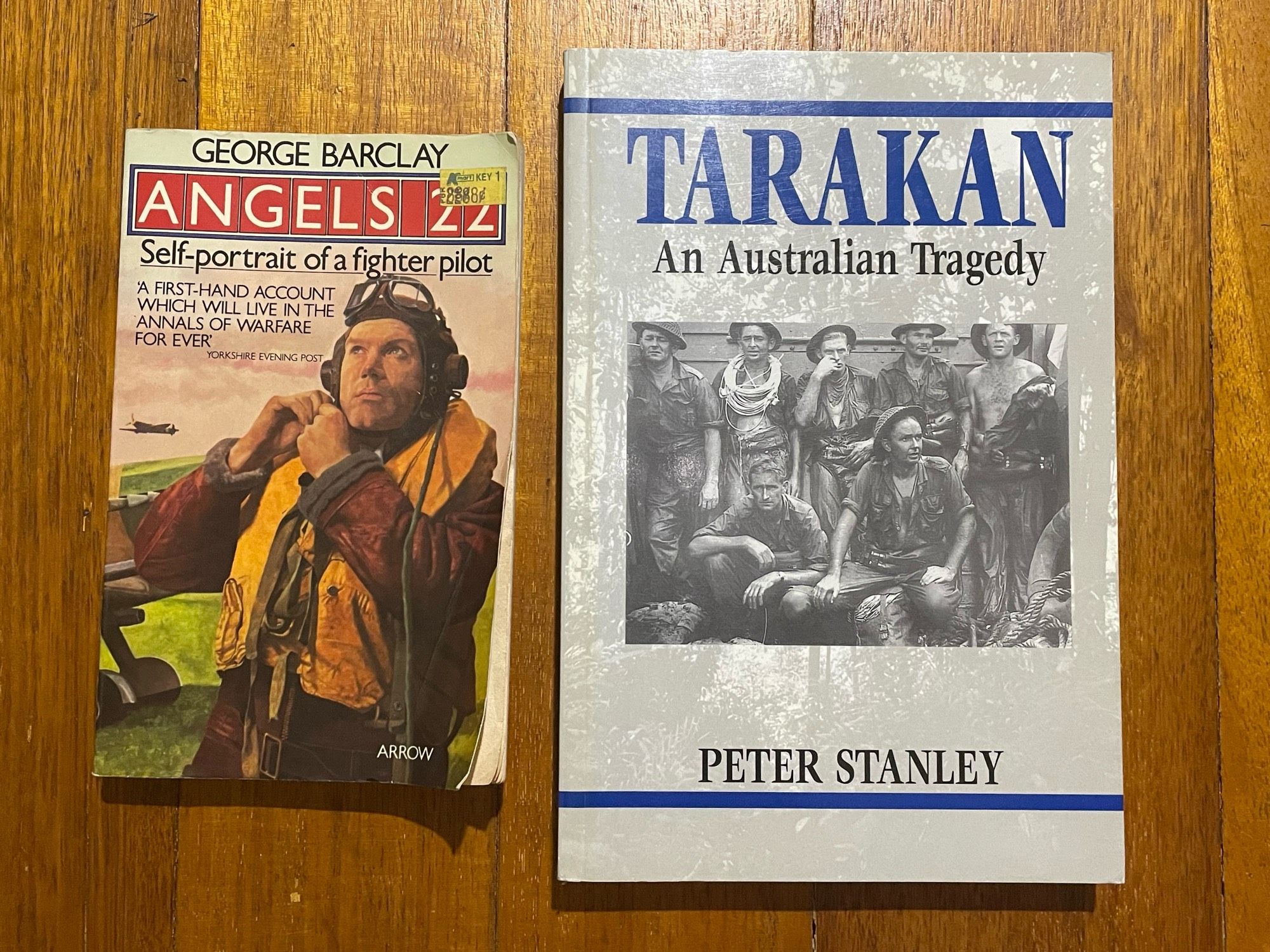 Covers of two paperback books about WW2 - “Angels 22” by George Barclay and “Tarakan” by Peter Stanley