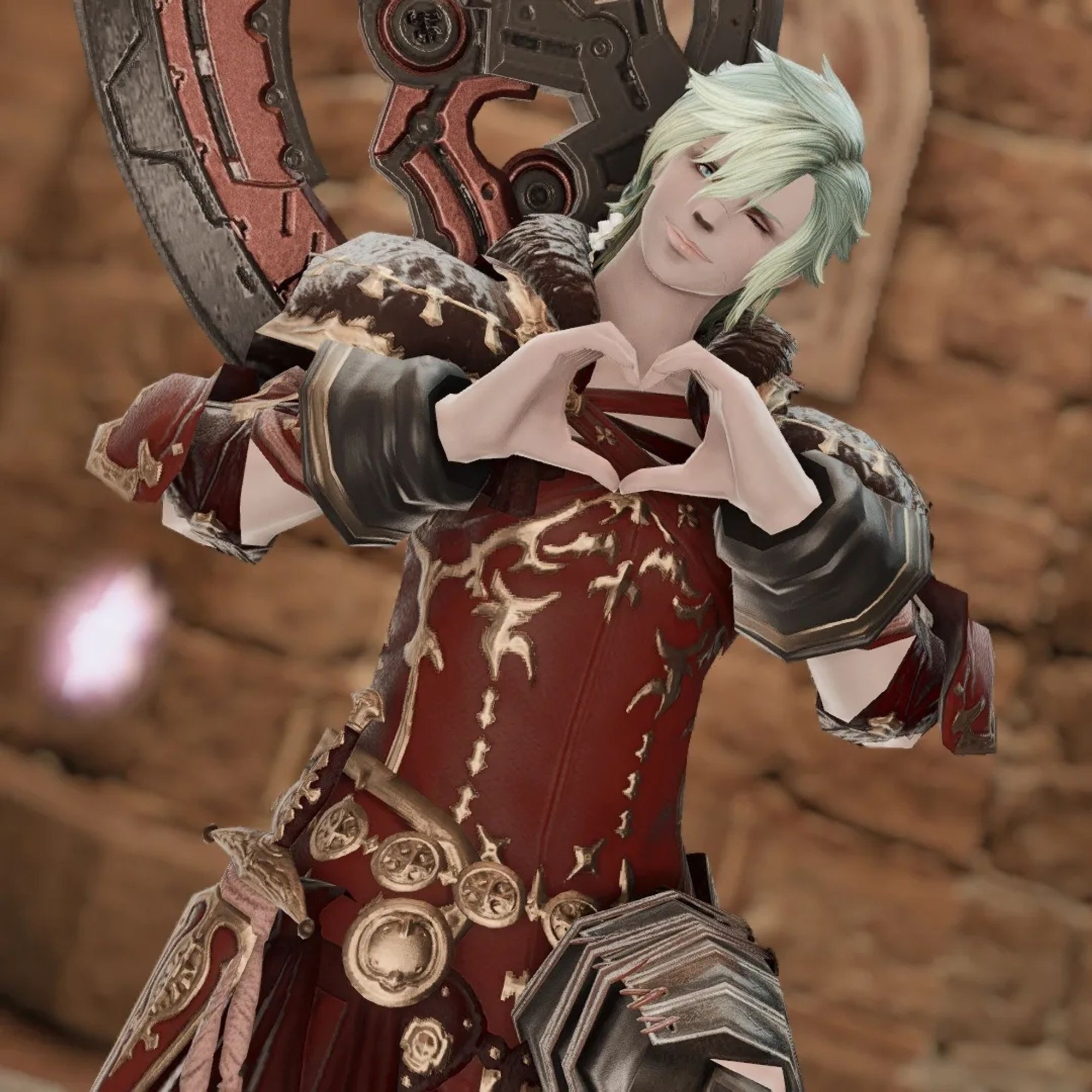 Quiltus using her hands to make a heart-shaped gesture for the viewer