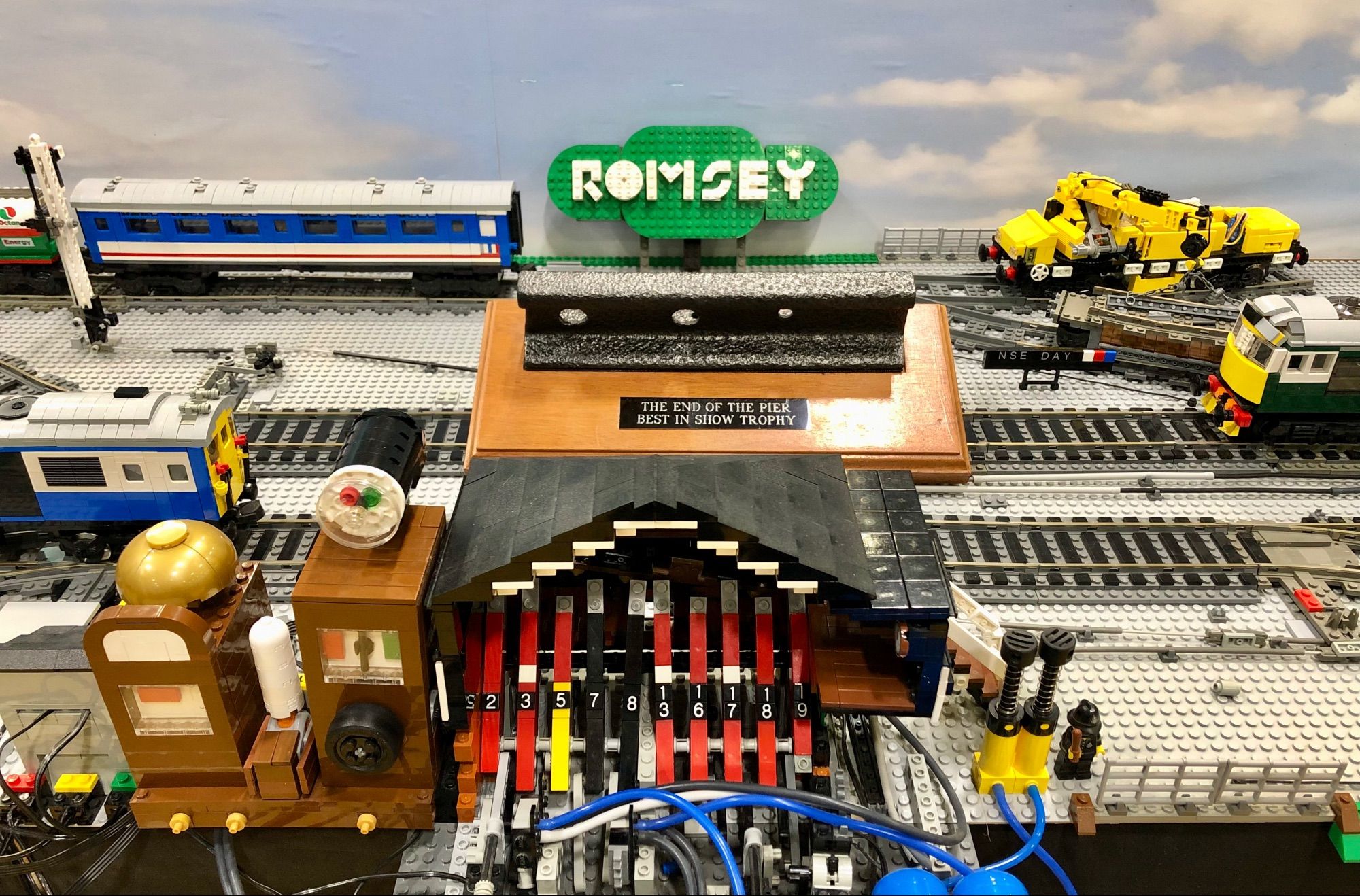 Model railway layout Romsey & Halterworth with the Fareham Model Railway Club trophy for Best In Show, public vote, at RailEx 2024.
The layout is fully signalled, all signals operational and works as a signalling demo display. 2 signal boxes, which can be worked by visitors at shows.
And yes it's all built from Lego bricks.