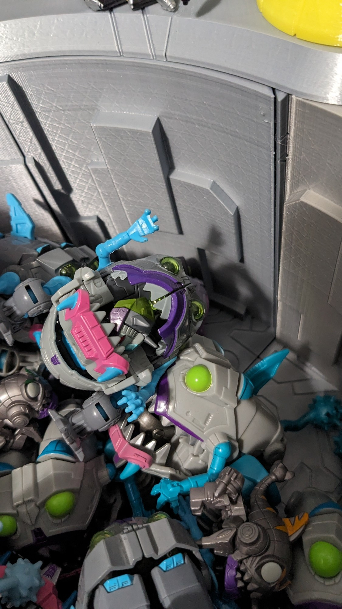 Another shot of sharkticons with one having a different allicon head in its jaws.