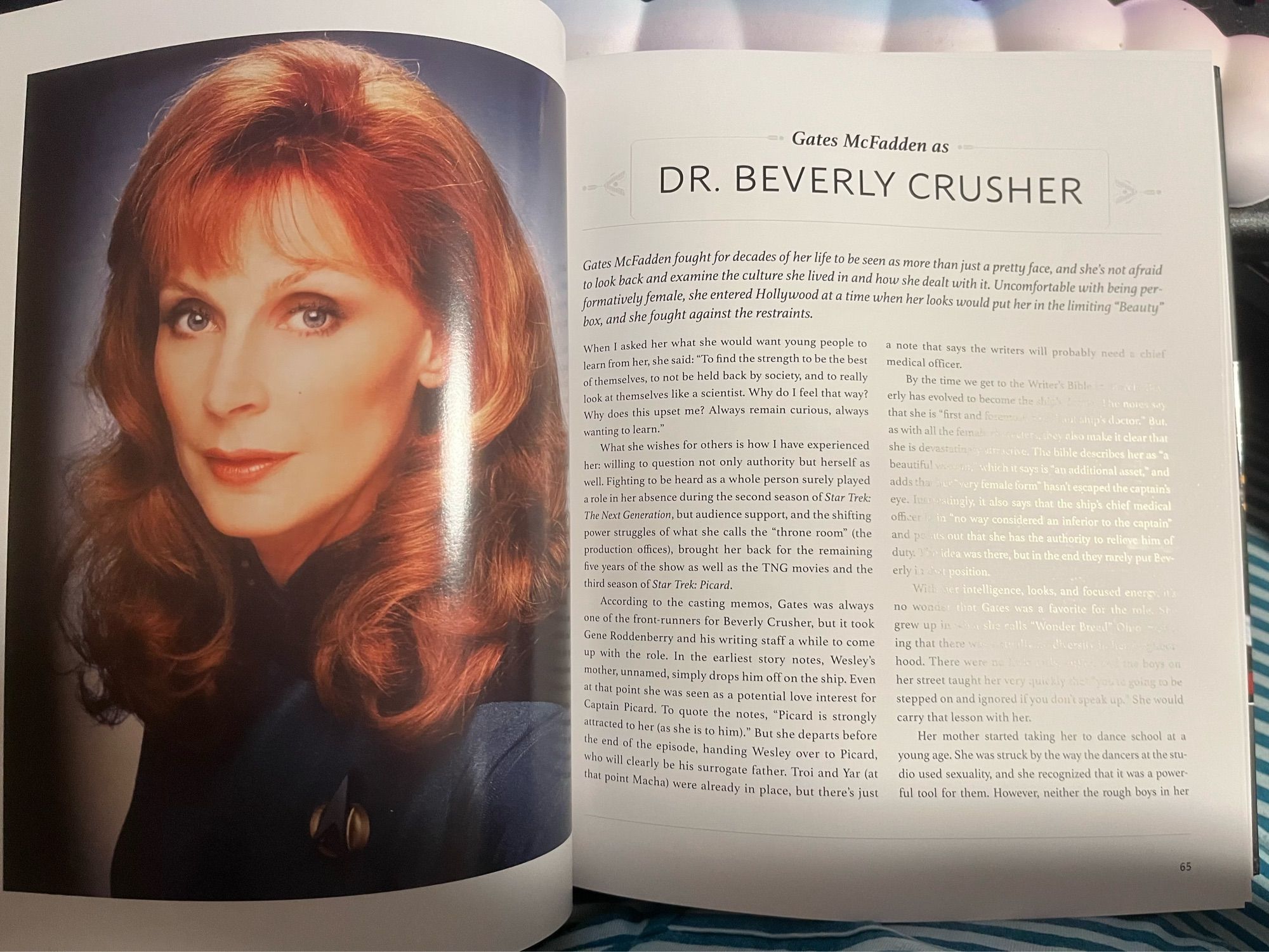 The beginning of the section on Beverly Crusher. Crusher’s headshot is on the left page. The header on the right reads Gates McFadden as Dr. Beverly Crusher.