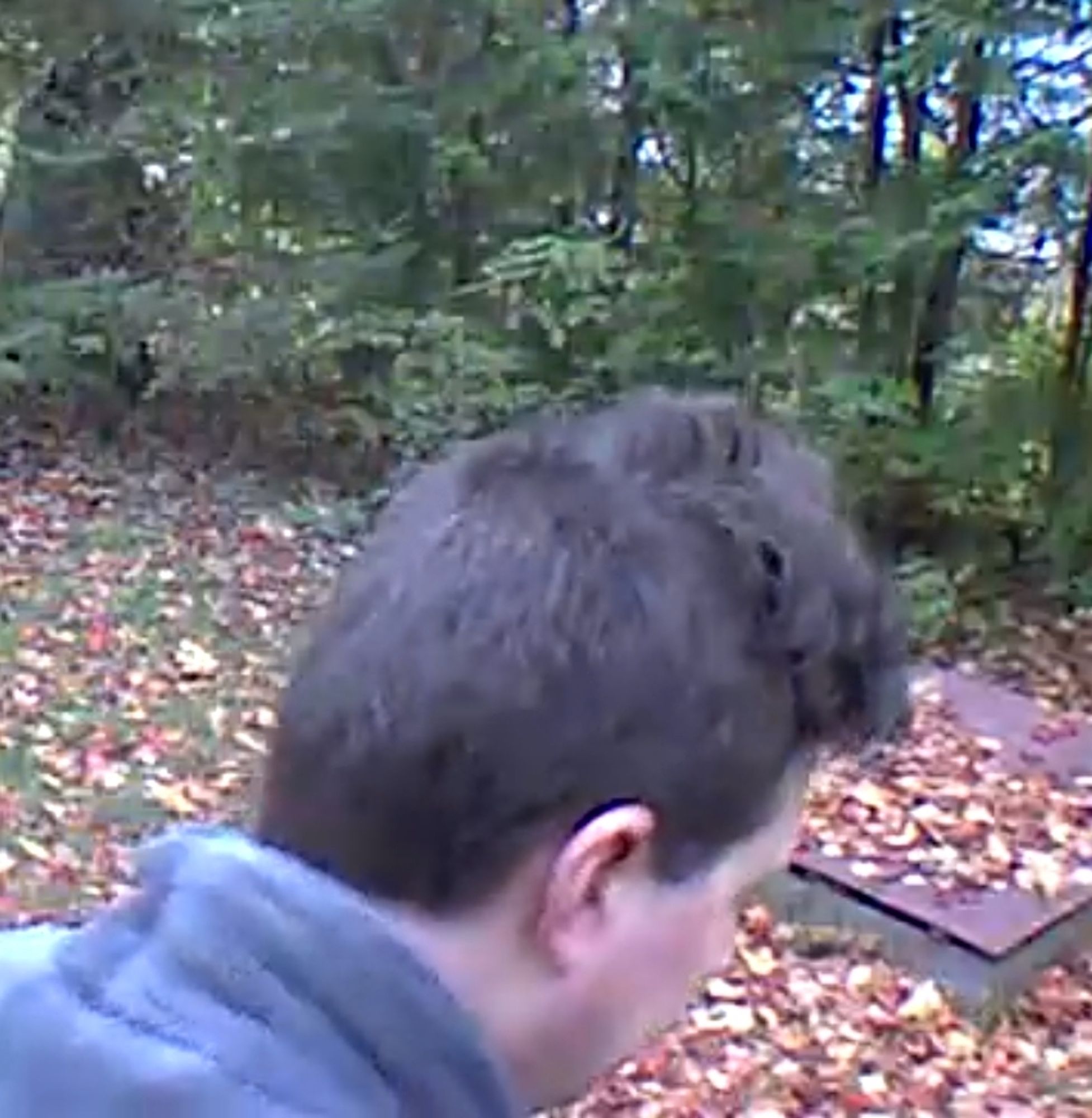 Security camera footage of the top back side of my dodgy self-administered haircut.