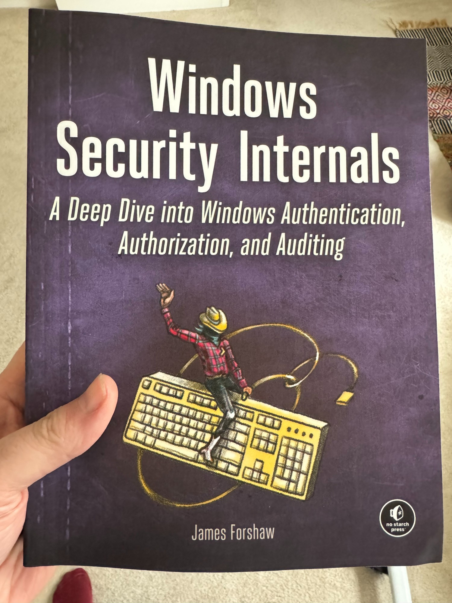 A copy of the book Windows Security Internal, available from No Starch Press that was written by the author of this post.