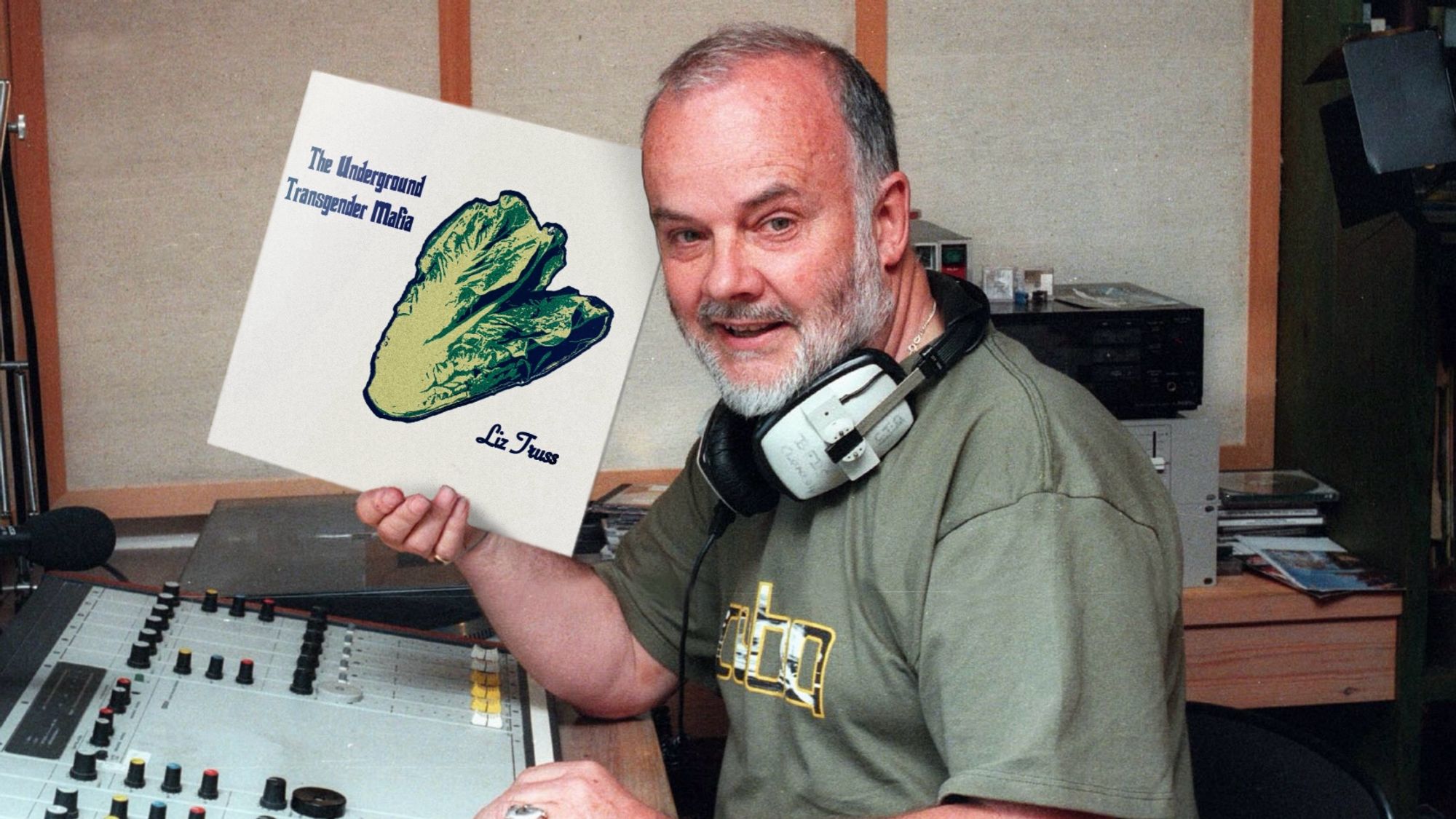 Older DJ with a close cropped beard, the late John Peel, sat at a studio mixing desk with headphones round his neck holding up a 12” vinyl LP cover “The Underground Transgender Mafia” with a Warholesque lettuce graphic print on a plain white background, the words ‘Liz Truss’ instead of ‘Andy Warhol’