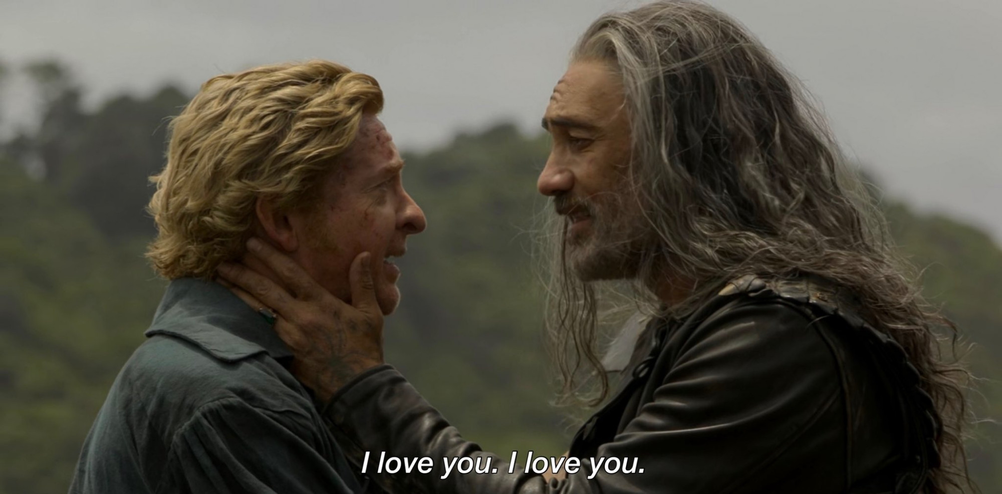 Stede and Ed are standing facing each other. Ed is gently cradling Stede's face in his hand. He says, "I love you. I love you."