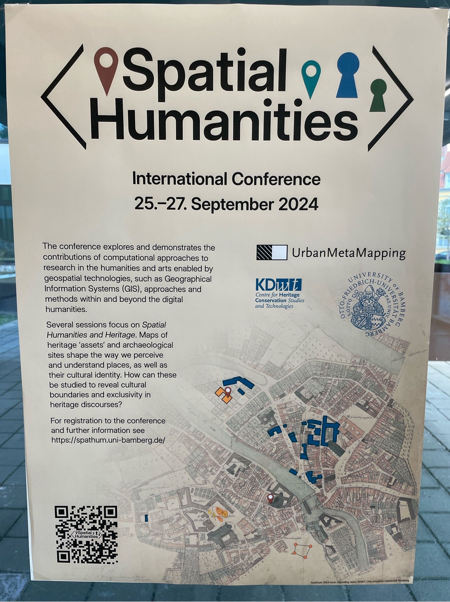 Poster on glass window for Spatial Humanities 2024 conference