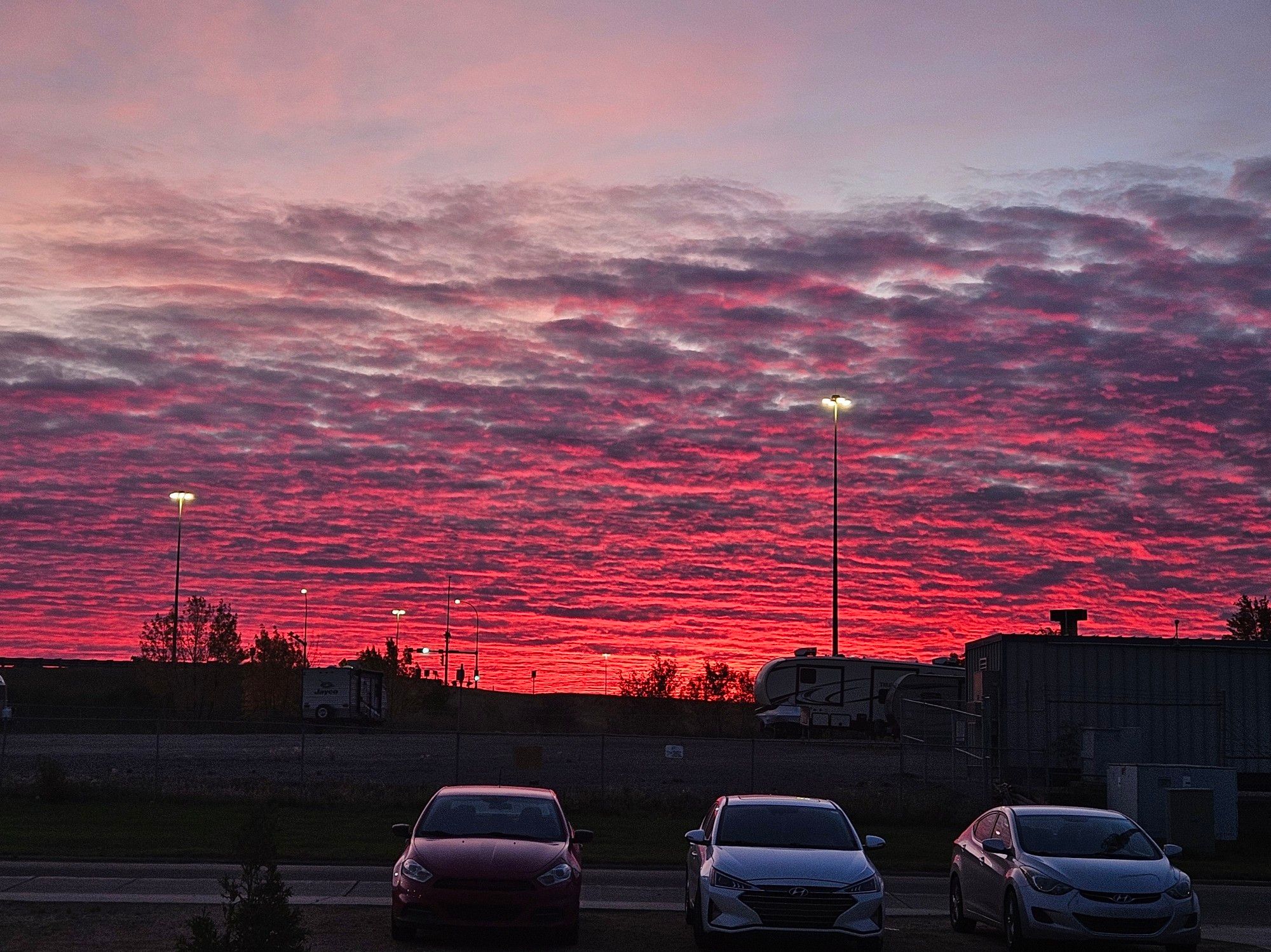 A pink sky with clouds