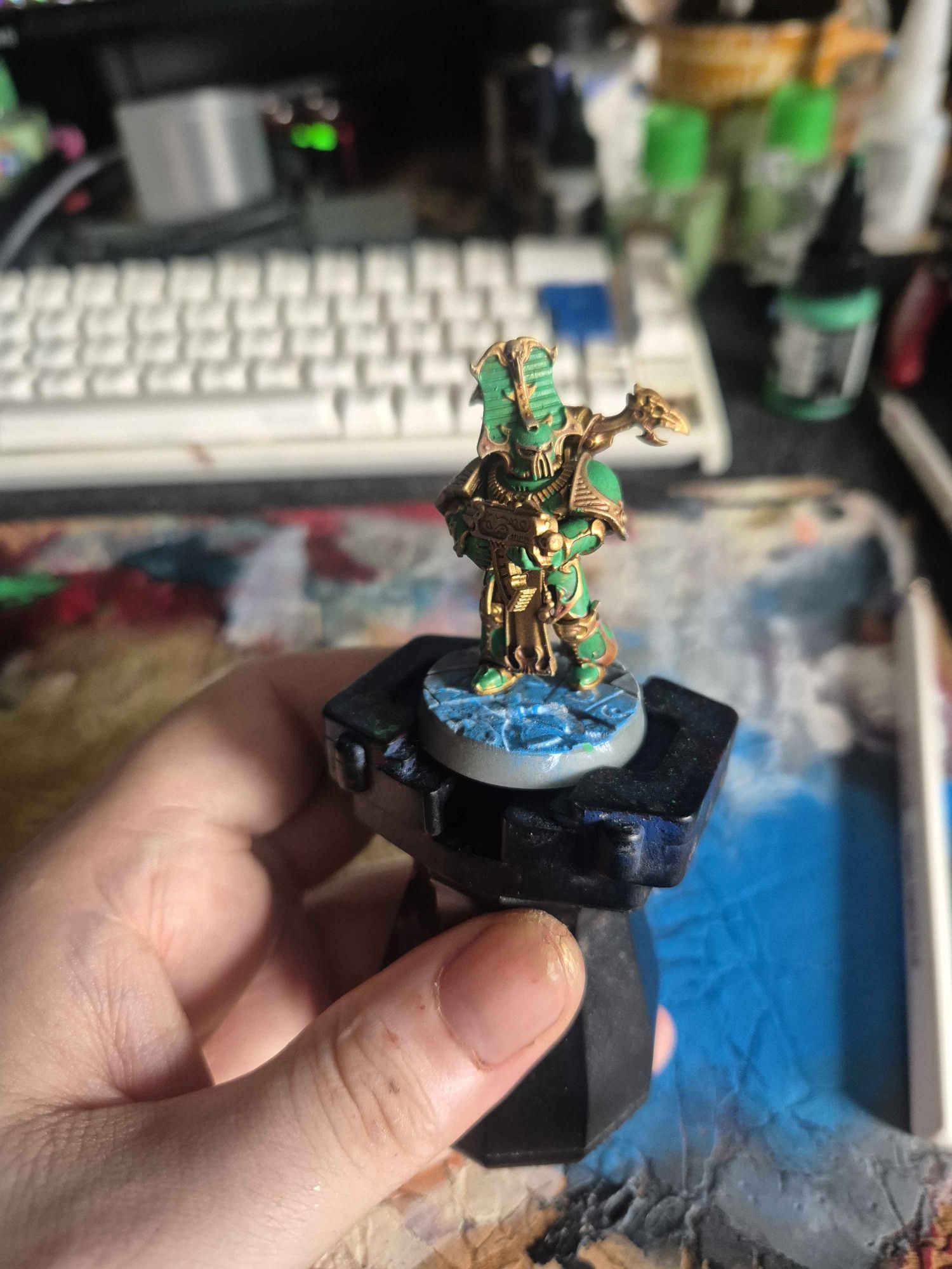 Rubric marine form the warhammer 40k table top minatures game. Gold trim with bright green armour panels