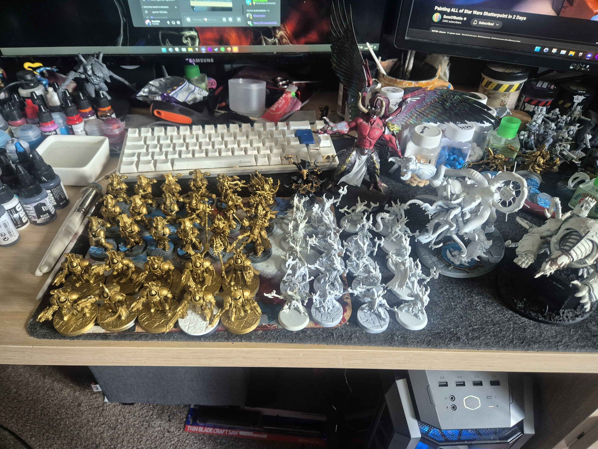 Thousand sons army for Warhammer 40k Table top Minatures Game on a desk. 

15 rubric marines plus assorted characters
10 Terminators
20 tzangor beast men,
Magnus the Red, Demon primach of the army
Mutilith vortex beast
Mauler fiend