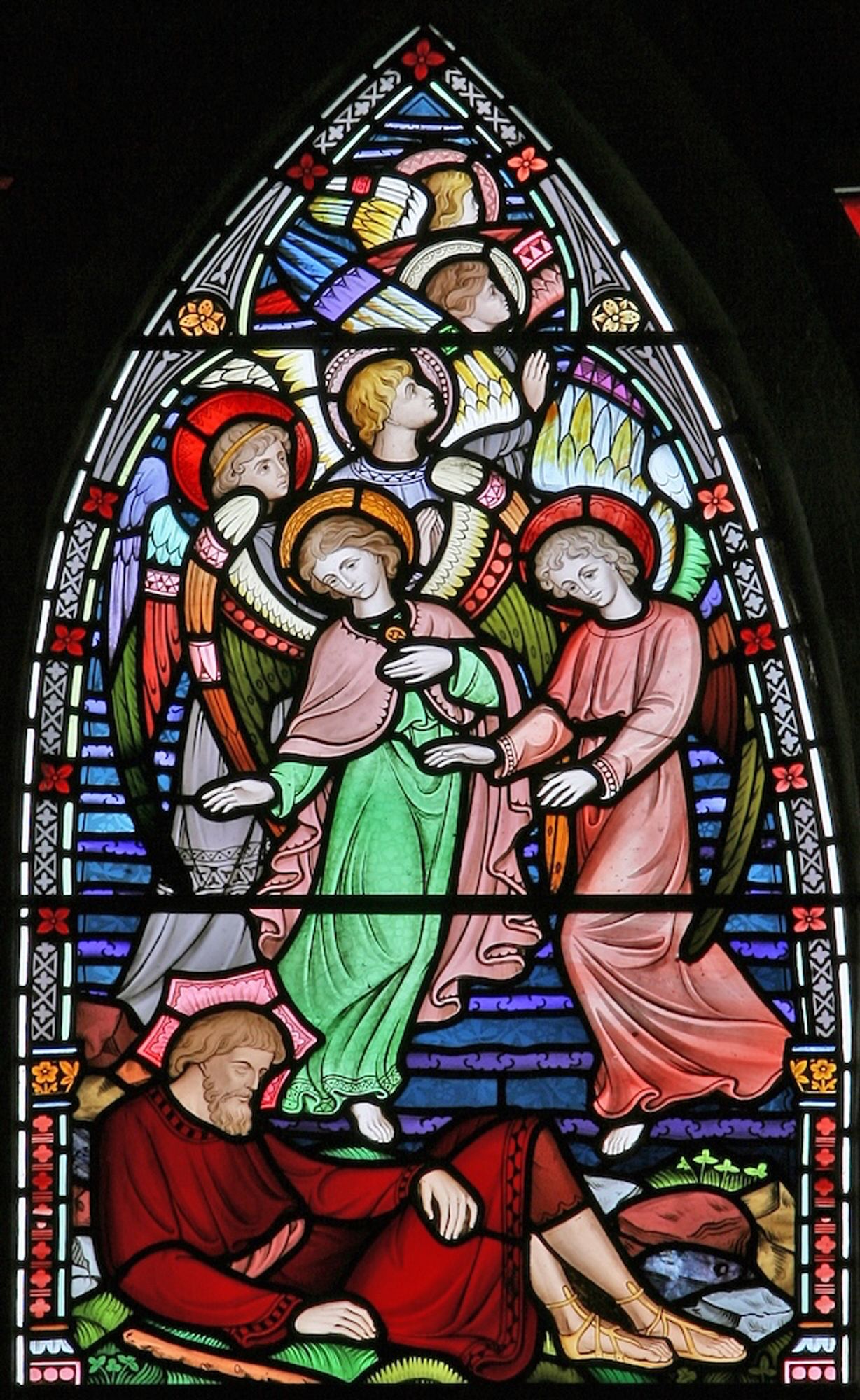 Stained glass depicting Jacobs vision of angels on a ladder. At the bottom, Jacob lies asleep. Above him, many angels with robes and wings of various colours., looking either upwards or downwards, on a set of steps receding up to heaven.