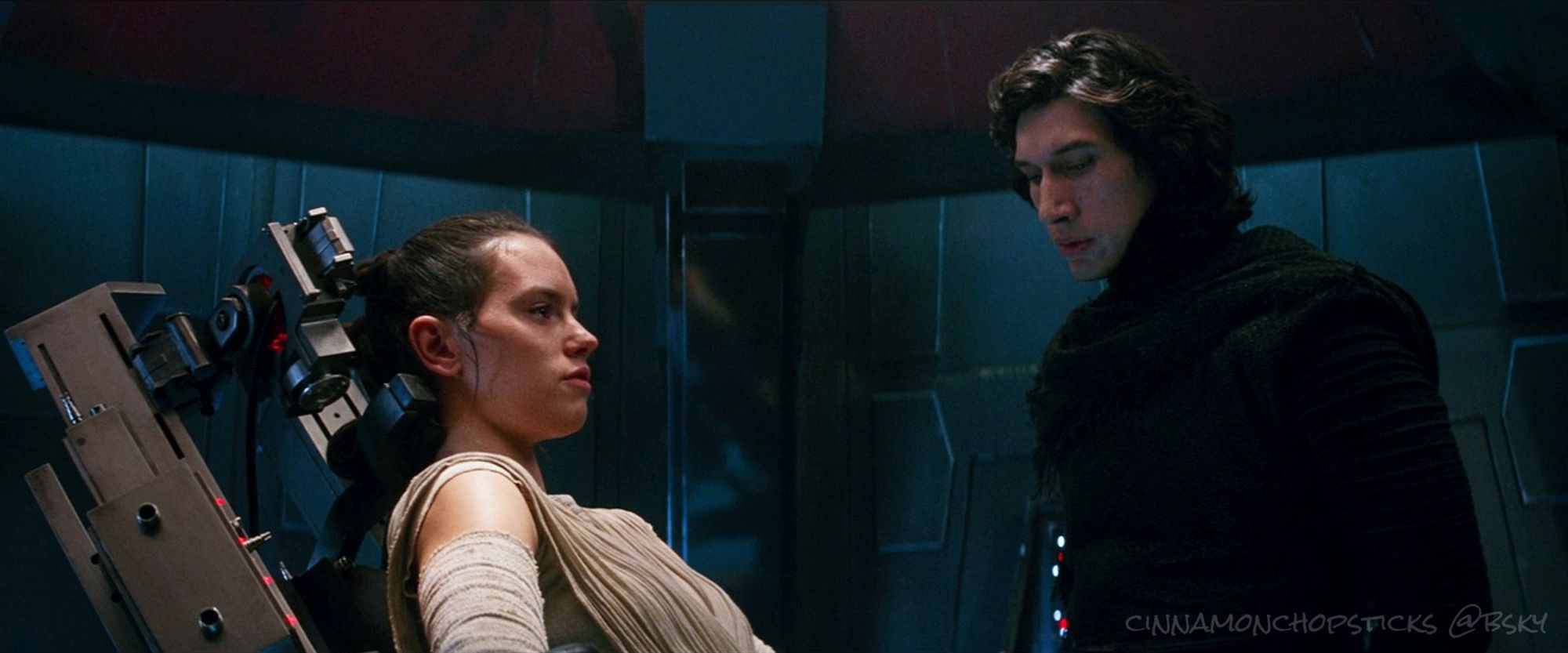 Kylo's eyes sweep over Rey as he interrogates her. Scene from The Force Awakens.