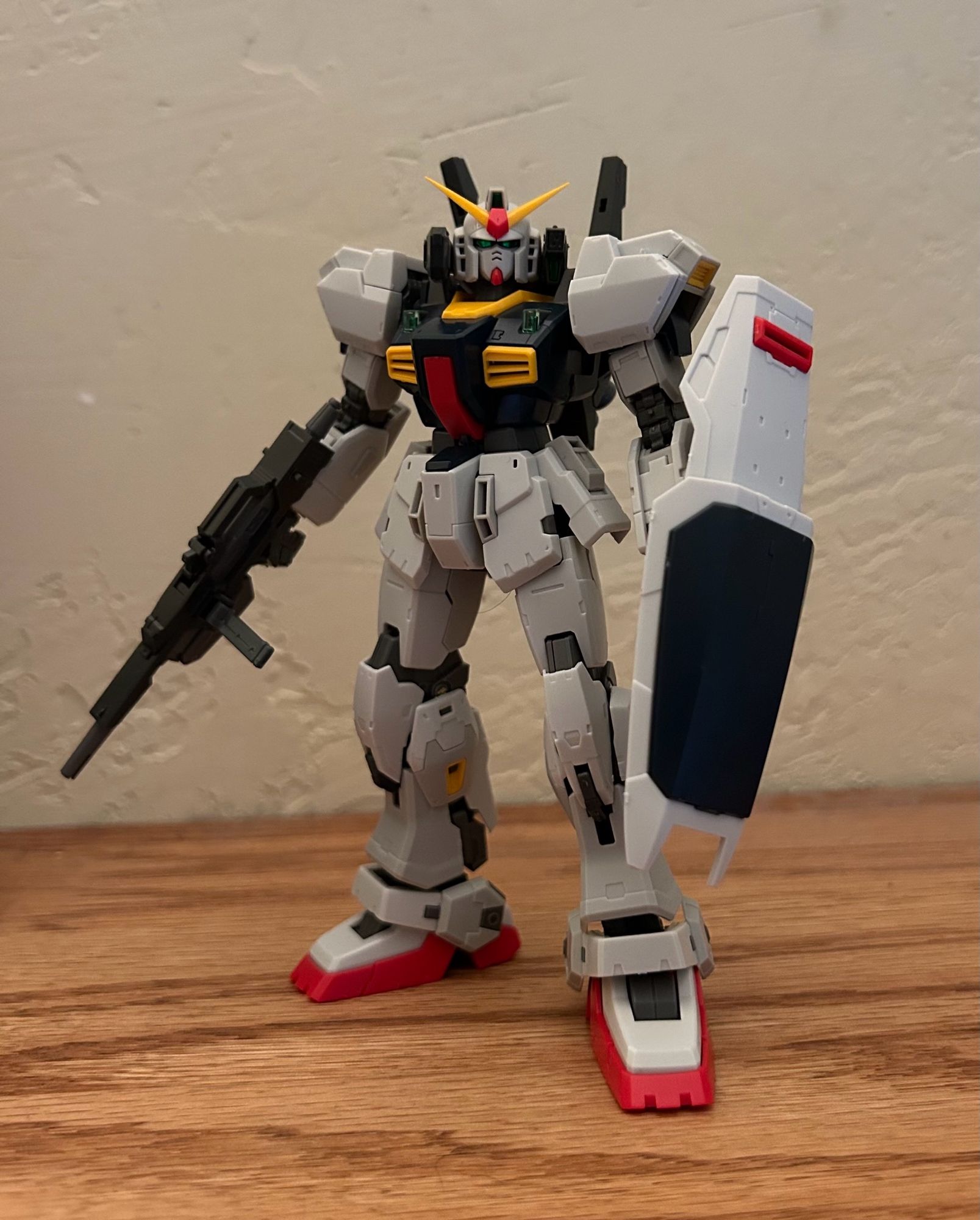 RG Gundam mk ii gunpla holding rifle and shield and looking at the camera