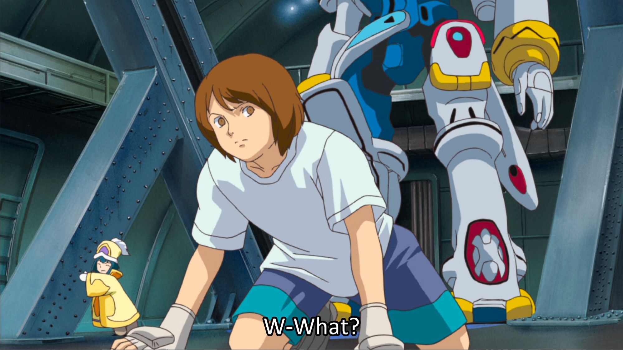 Gainer kneeling on the ground in a t-shirt and shorts without his glasses. His hairstyle is very similar to that of Kamille from Zeta Gundam so without the glasses he looks a lot like Kamille imo.