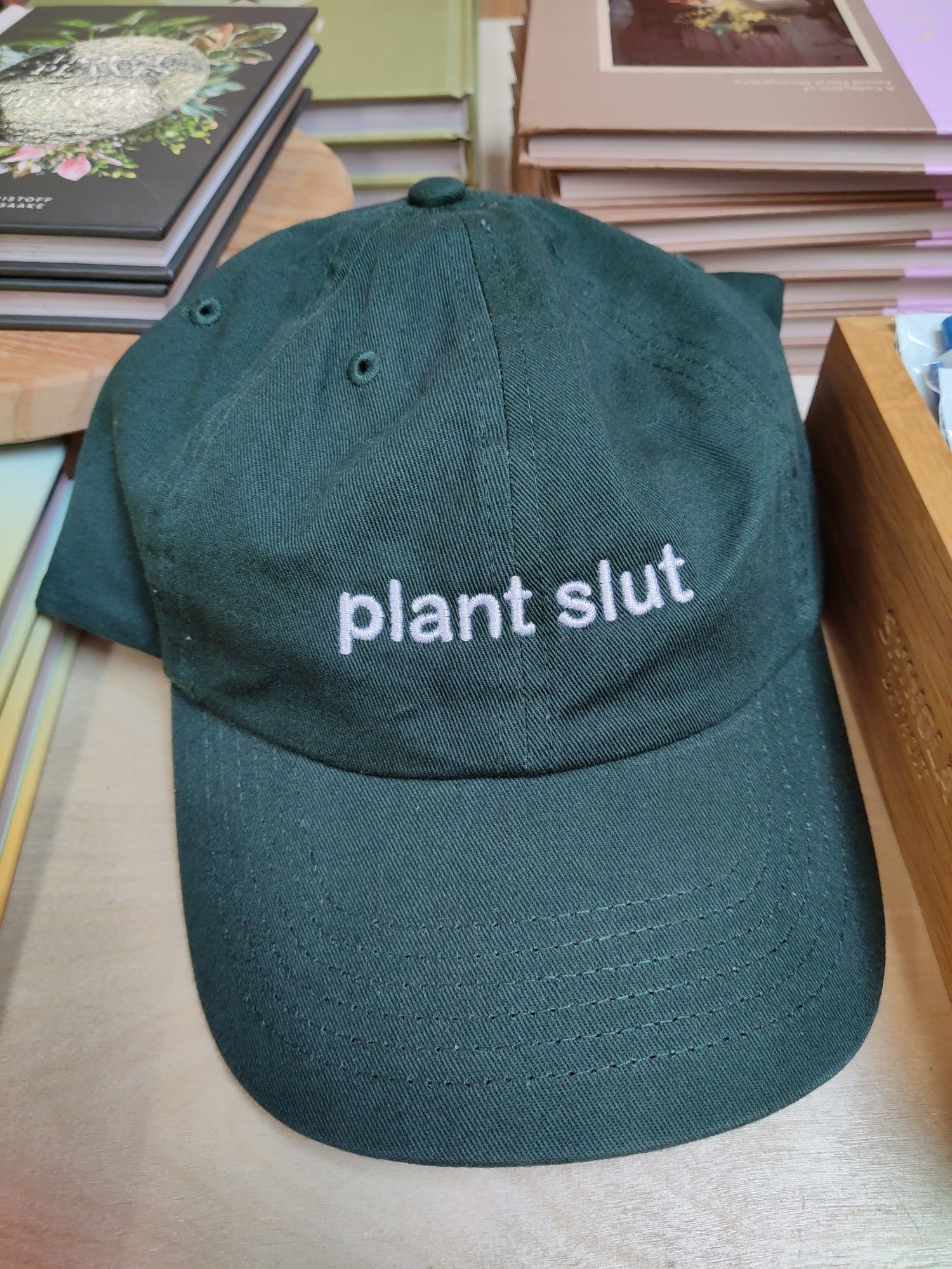 baseball cap with words "plant slut"