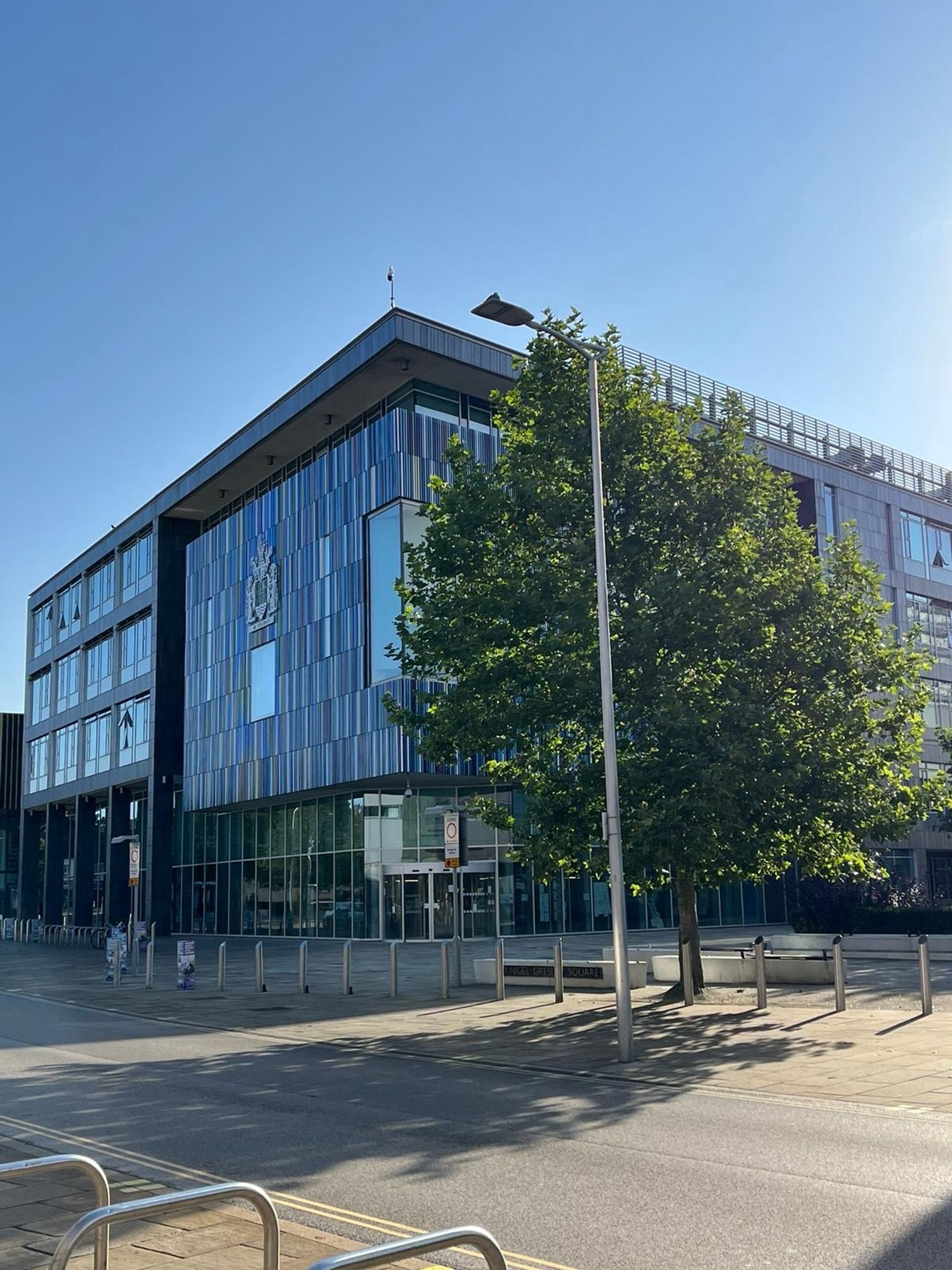 The civic building in Doncaster behind a large tree, with very blue sky in the background.