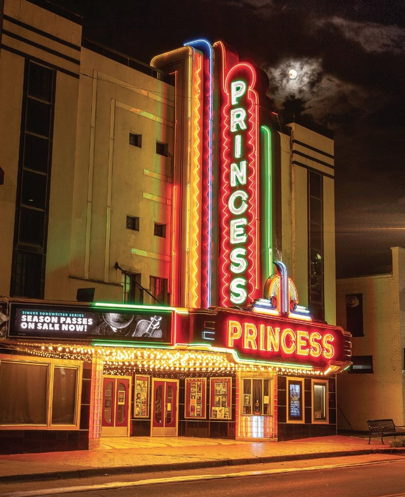 The neon marquee and façade of the art deco style Princess Theatre in Decatur, AL.