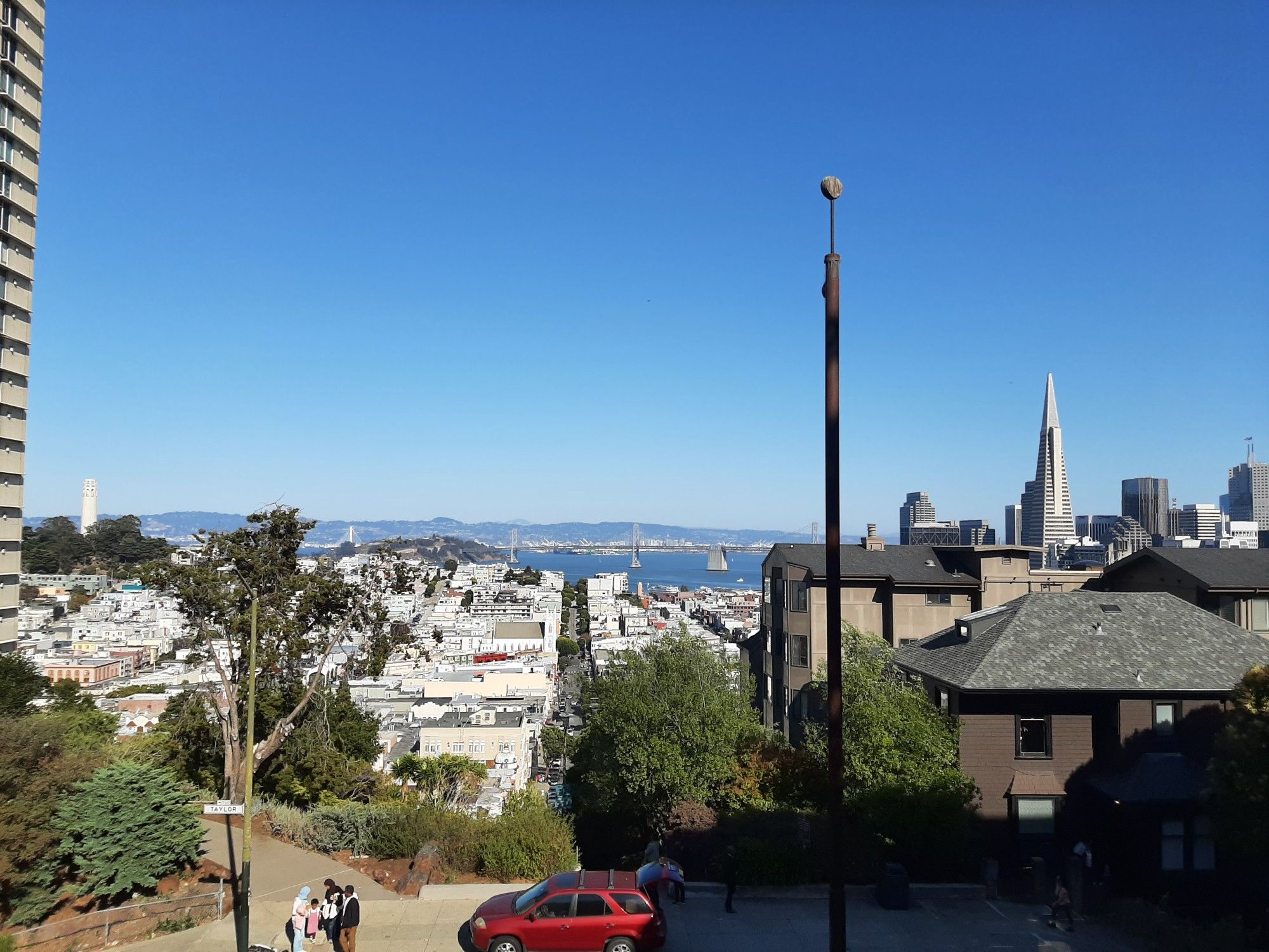 A view down Vallejo St towards the Bay Bridge, Yerba Buena Island, and Oakland.