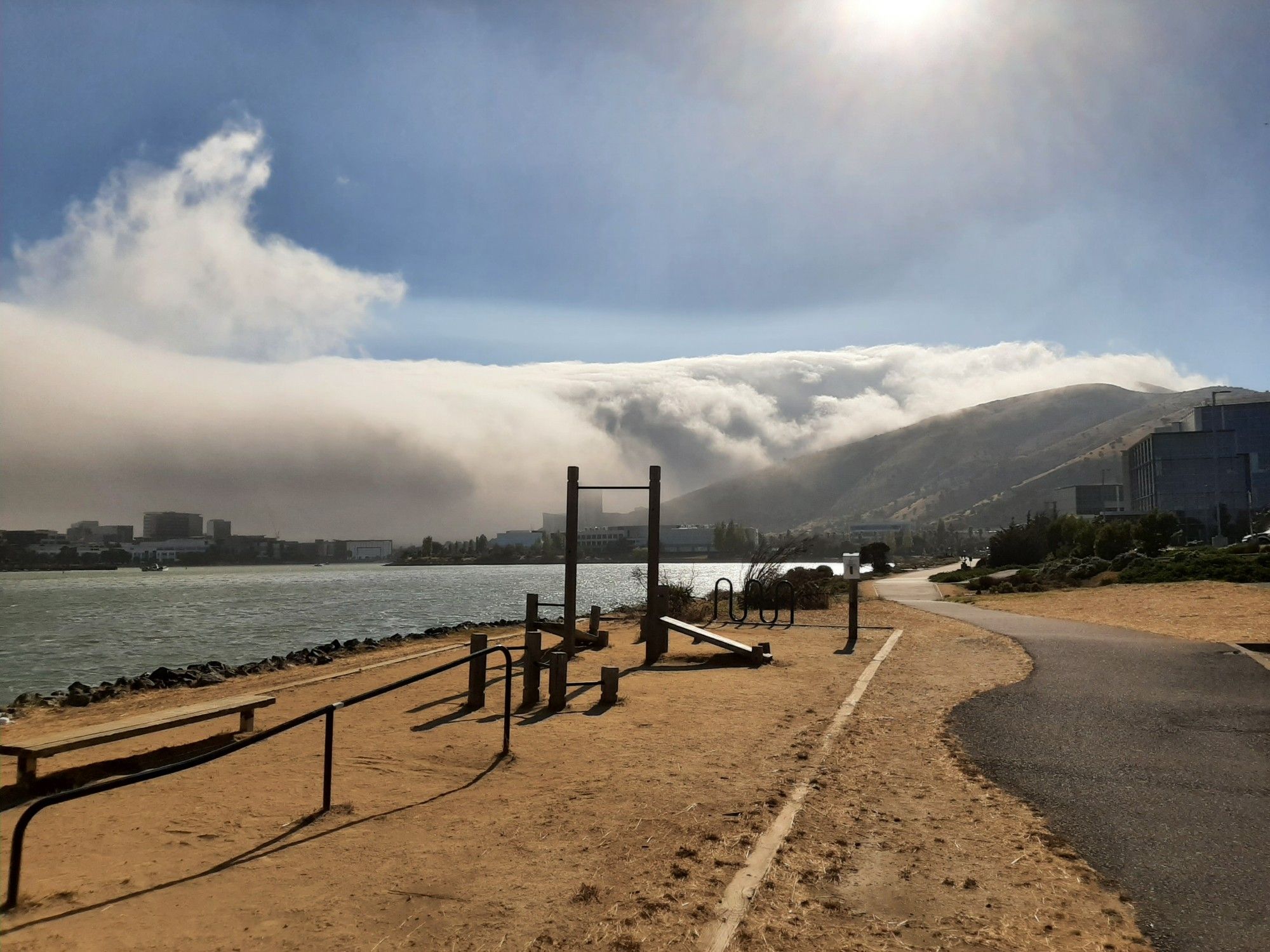 An avalanche of clouds flowing over San Bruno Mountain and upon South San Francisco.