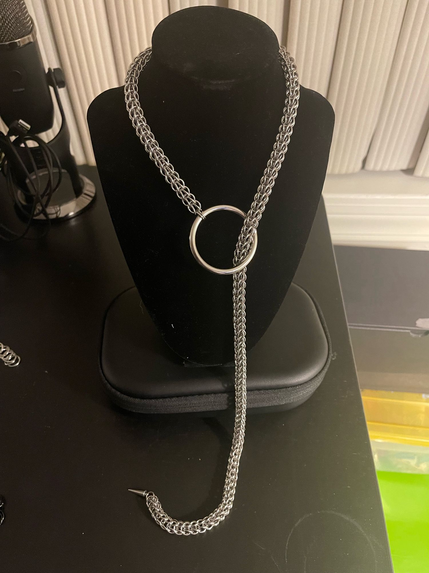 My own take on the necklace Sansa Stark wears on Game of Thrones. A slip chain necklace with a large o-ring and spike at the end.