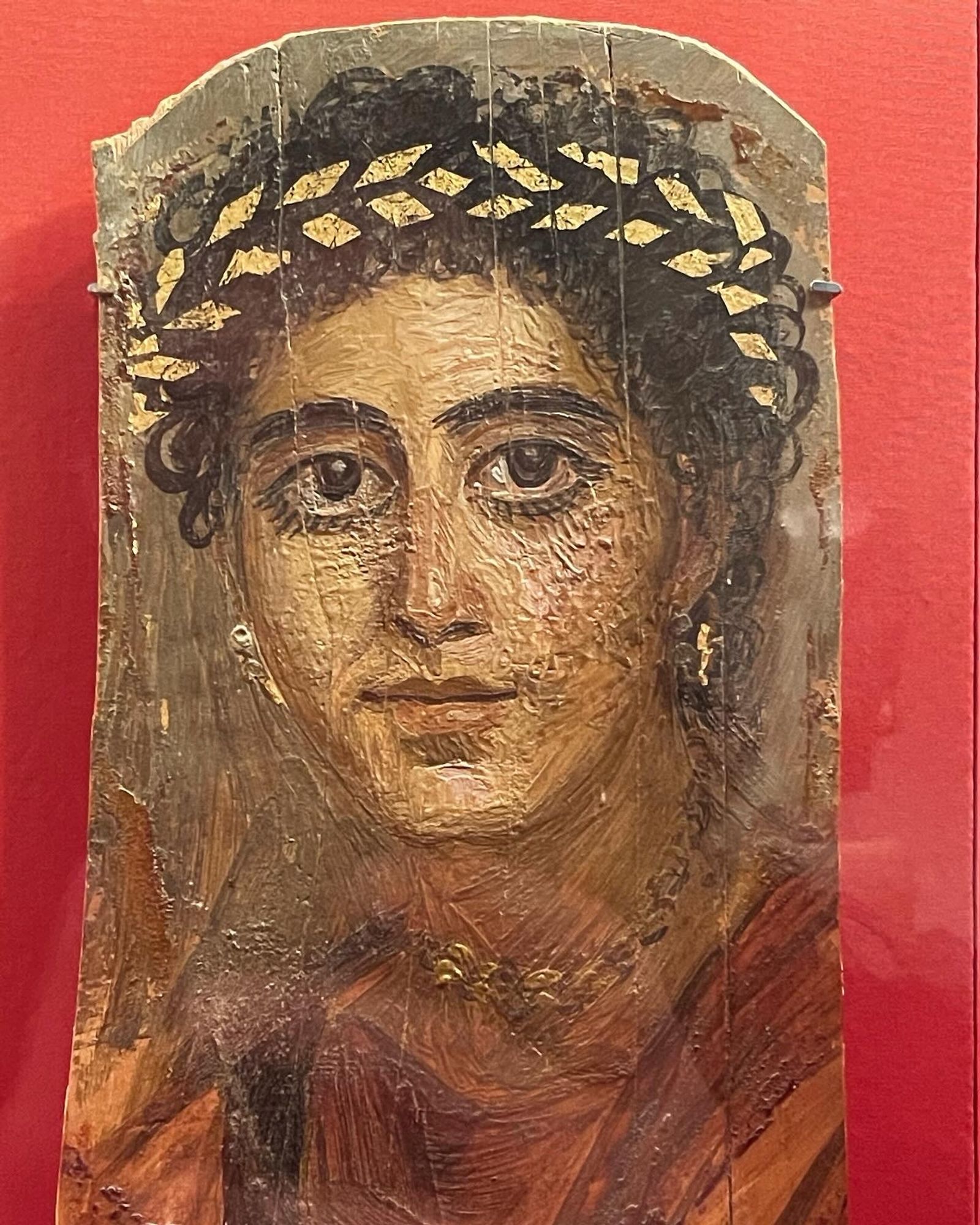 Portrait of a Young Woman in Red
Ca. A.D. 90-120
Encaustic on limewood with gilded wreath and traces of gold on the background and jewelry