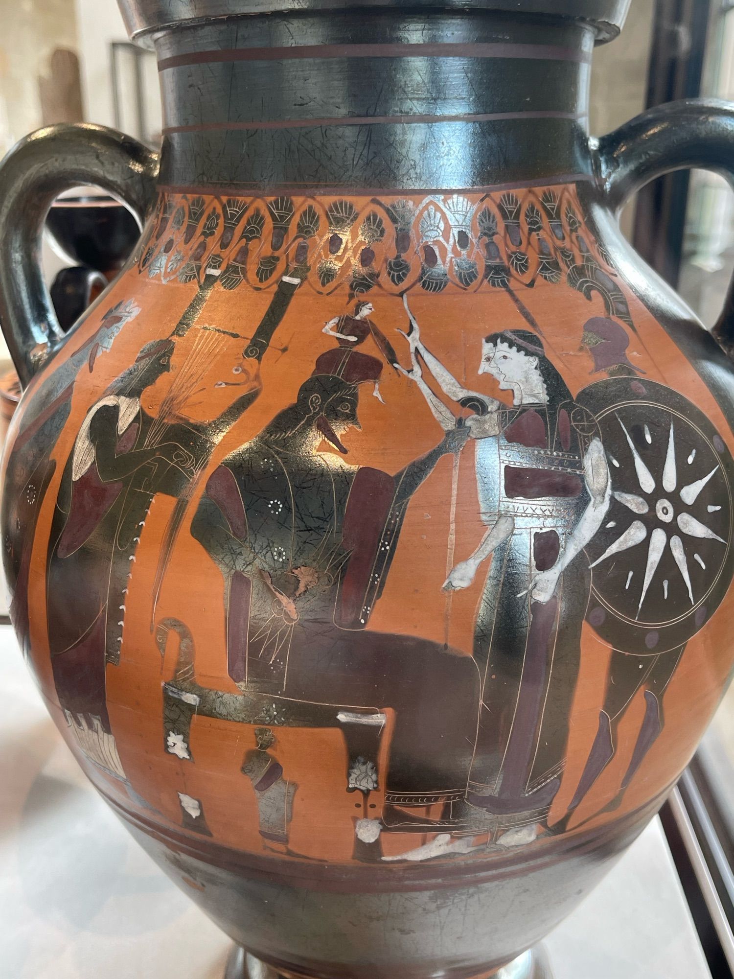 An amphora depicting the birth of Athena popping out of Zeus’ head 
Terracotta, black-figure, with added red and white slip