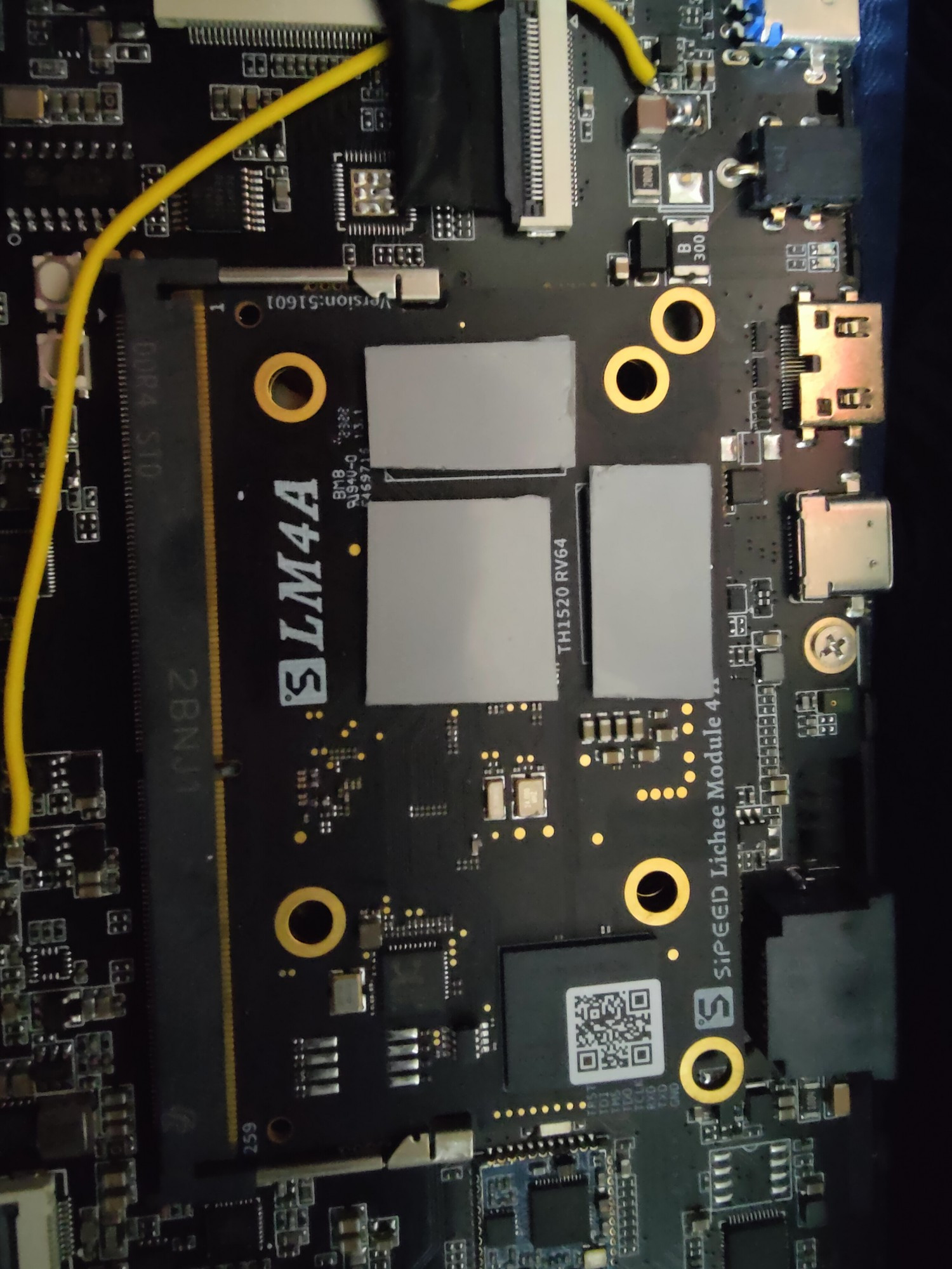 Innards of a LicheePi 4A Console, with phase change adhesive pads